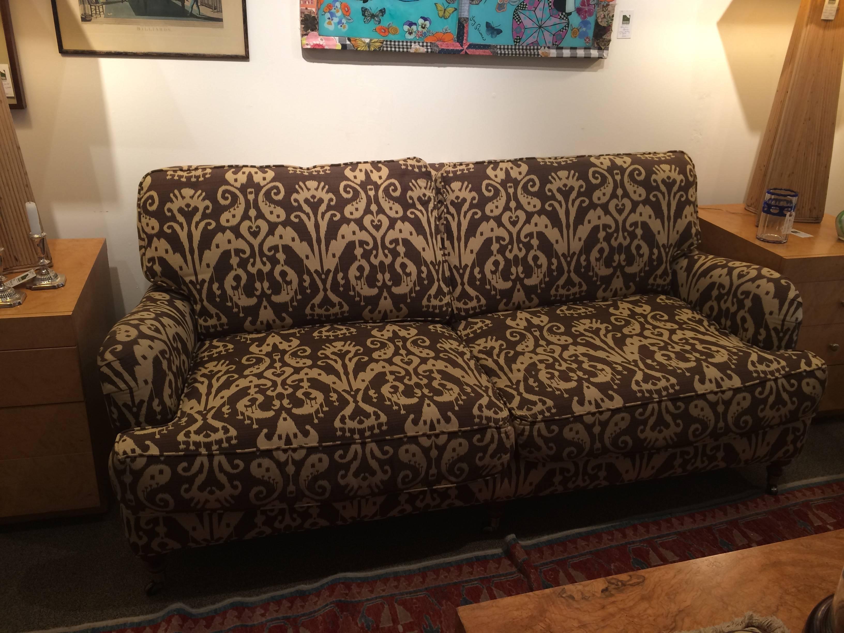 Great looking sofa by Lee Industries with two-seat cushions and two back cushions and two matching extra pillows. Custom brown and cream Ikat fabric.
Very comfortable!