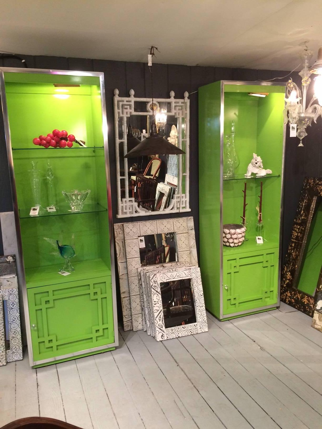 Mid-Century Modern fretwork cabinets by Thomasville in original chartreuse green lacquer finish with adjustable glass shelves, chrome detailing and clear round acrylic pulls to base cabinets. Extra original brass hardware for more shelves. Comes