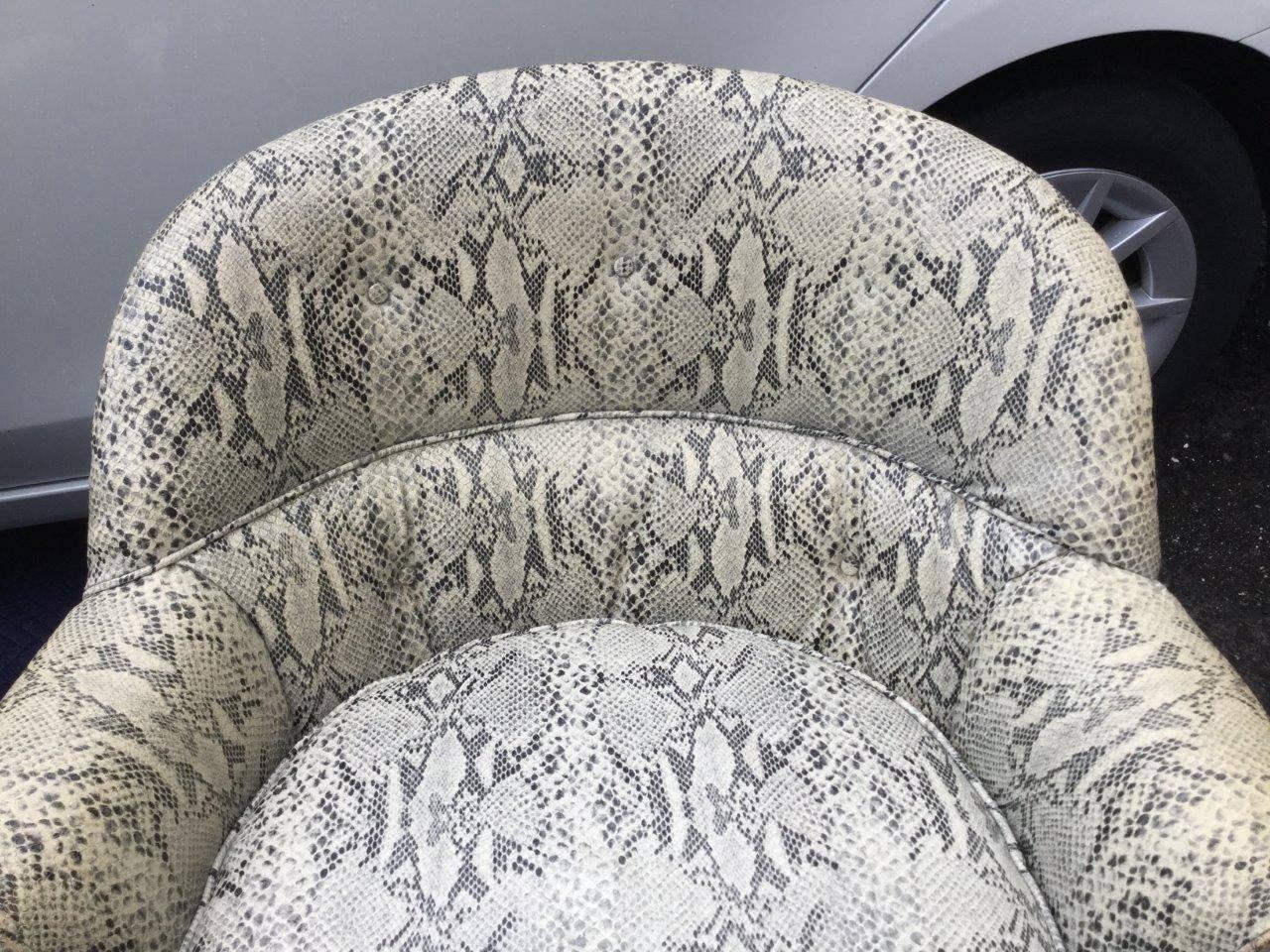 Unusual pair of 1940s faux snake-skin club chairs featuring the
original upholstery and swivel mechanism. Mint condition.