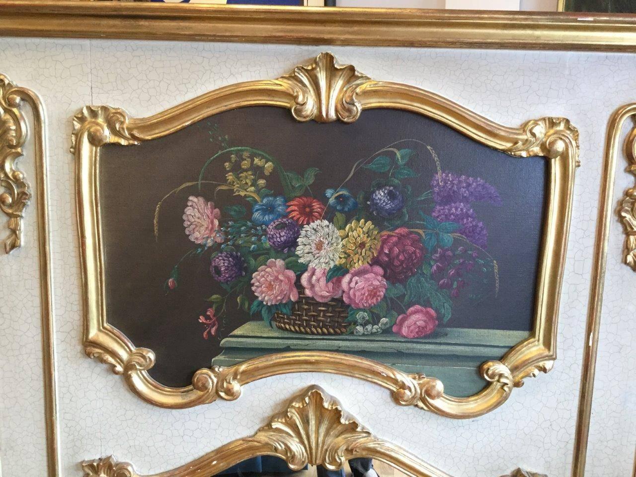 French Louis XV style painted and giltwood trumeau mirror of elmwood with original detailed floral still life enveloped by gorgeous moldings.
 