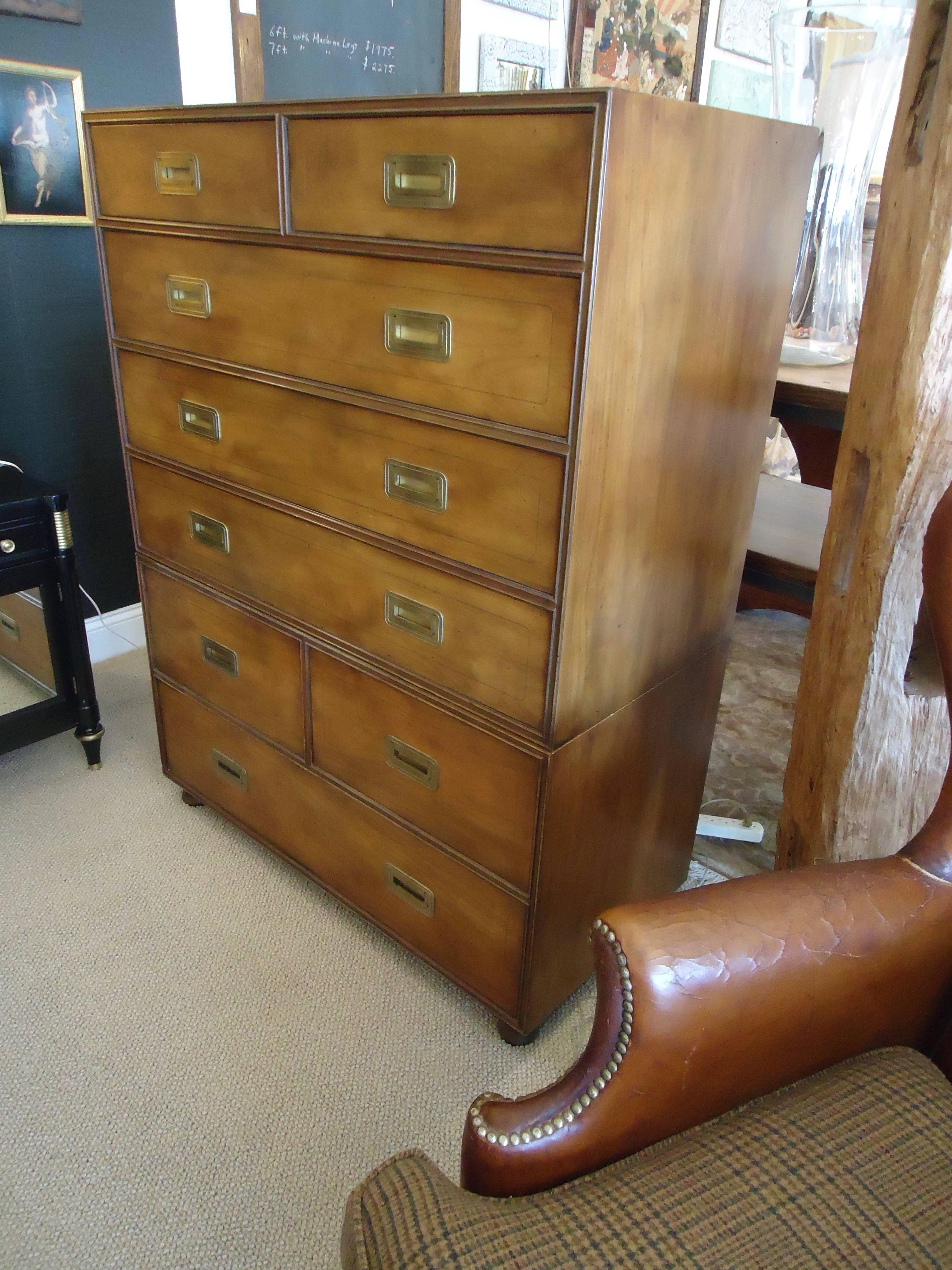 Handsome wooden dresser with brass recessed hardware in the campaign style, four small drawers and four large drawers. Can be used as seen in photo, or in two parts. The top part can stand alone having two small drawers and three large. Extra feet