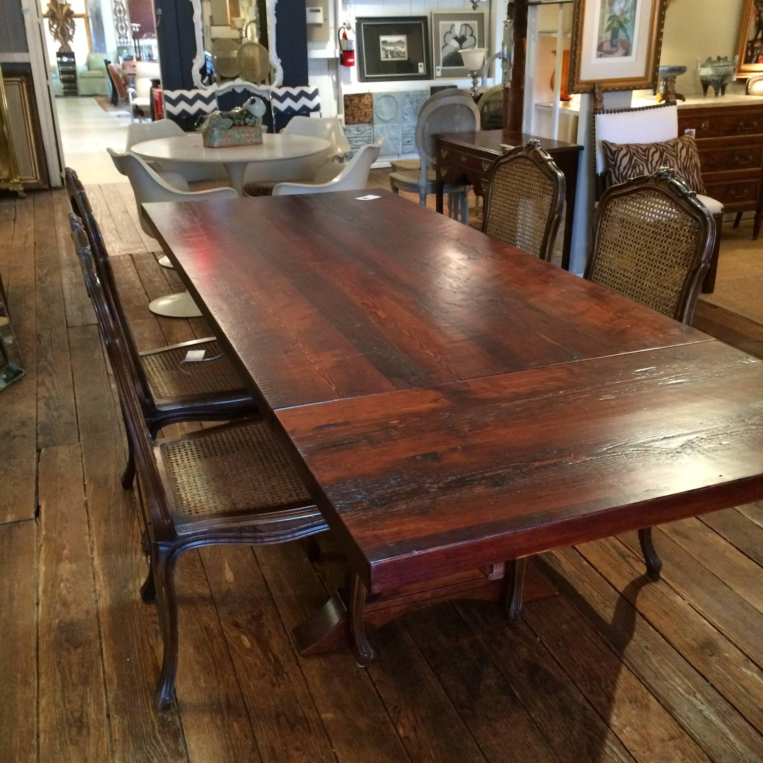 Gorgeous reclaimed old pine stained a dark walnut color with classic trestle base and outfitted for two 18 W extensions for larger gatherings.