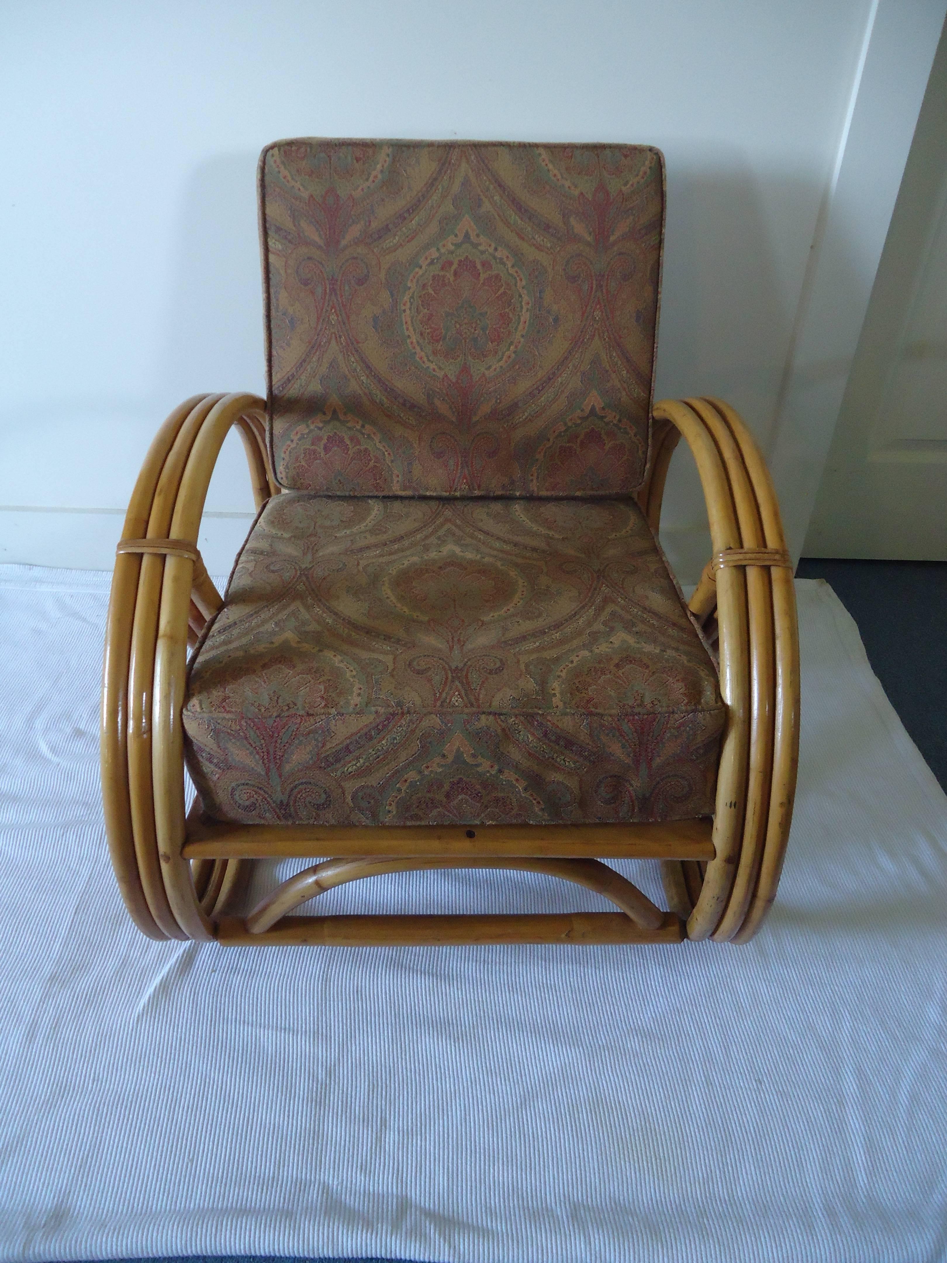 A great looking vintage set of four rattan pretzel chairs including three matching club chairs and one reclining larger chair with new paisley Ralph Lauren fabric on the cushions.
Measures: 32 D 28 H 26.5 W seat height 16.5.
Single recliner 29 W