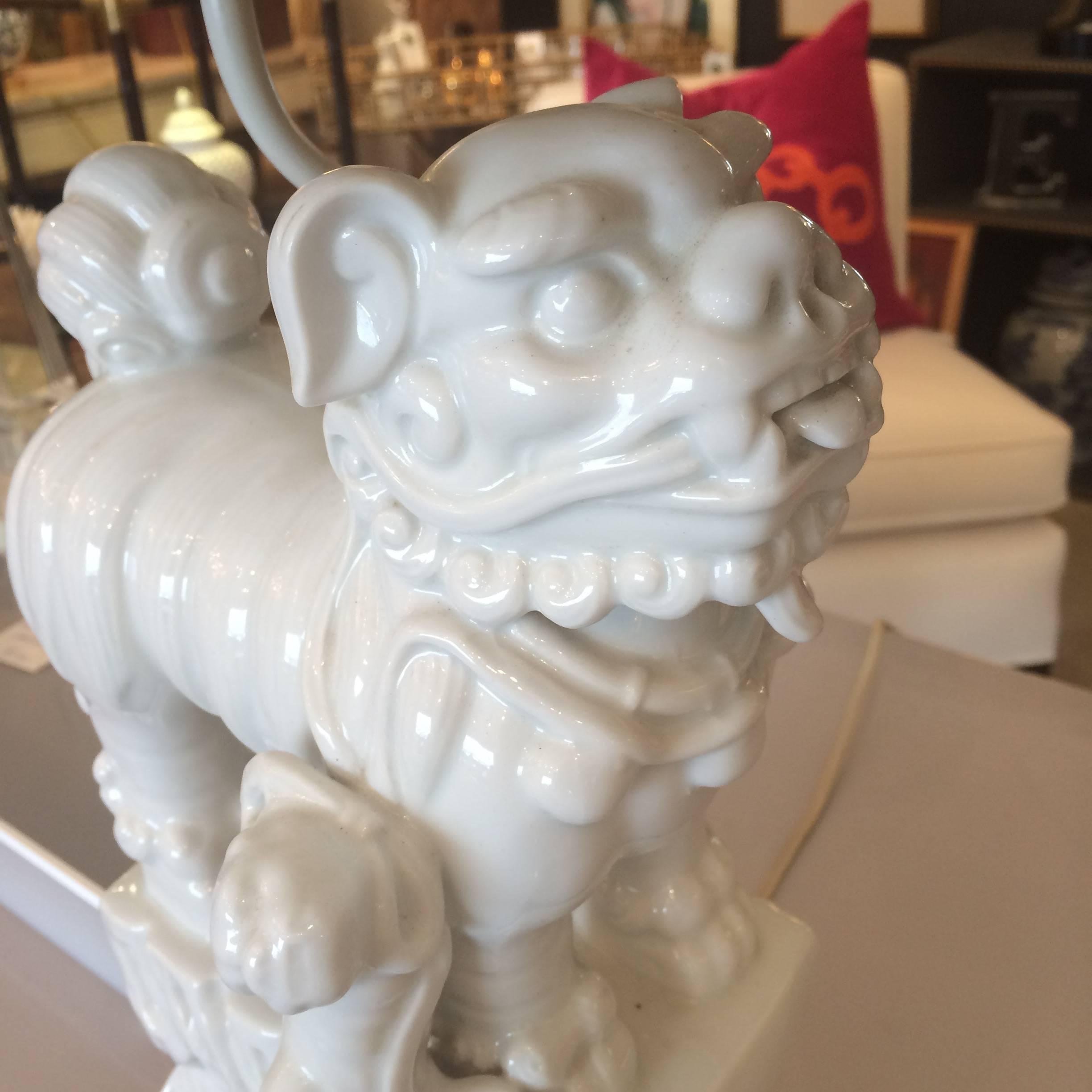 Two super stylish white porcelain foo dog sculptural lamps with fabulous ornately pleated custom shades in a multi-patterned black, taupe and cream fabric. Foo dogs are 9