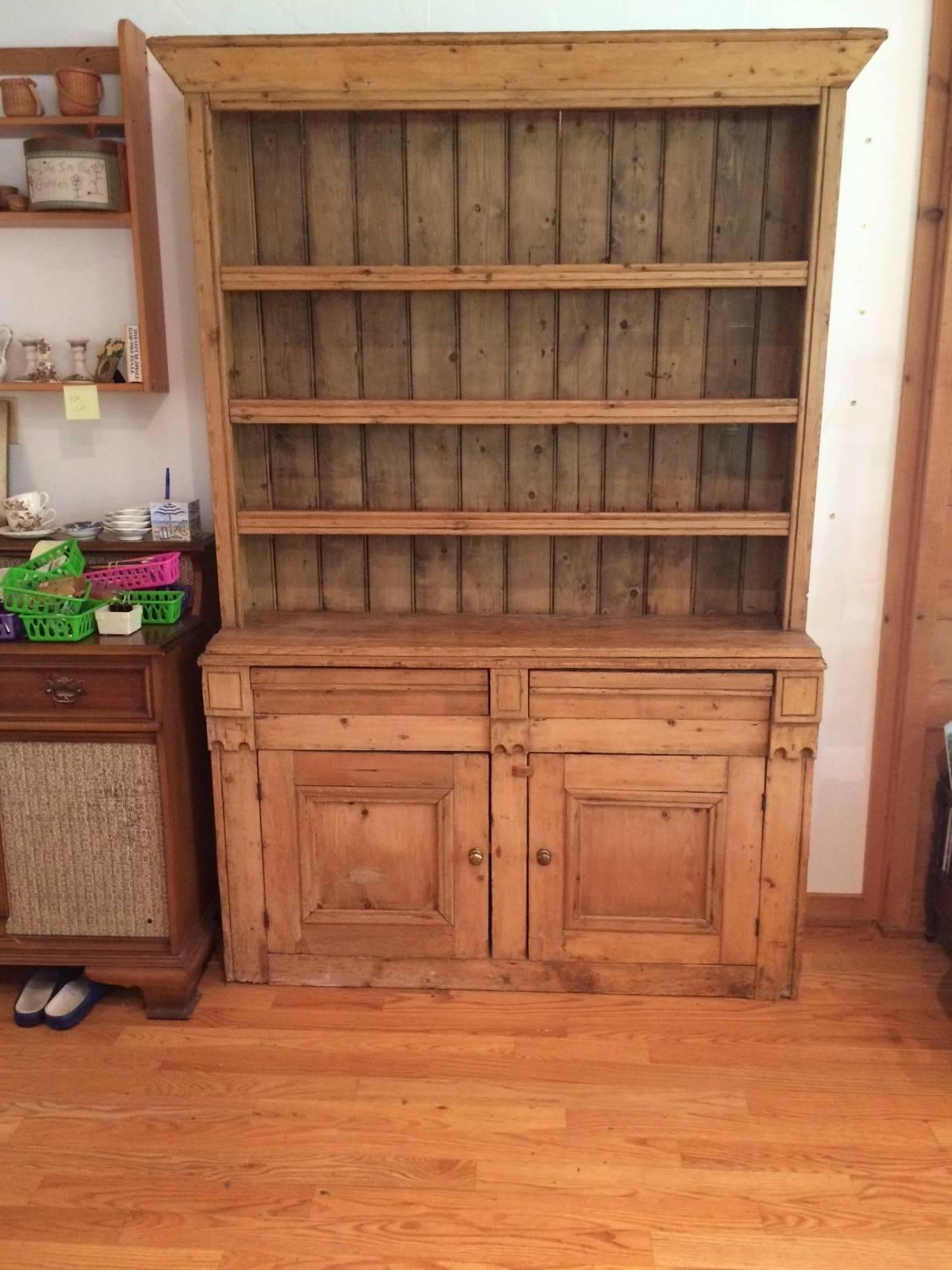 This antique old hutch conjures up Vermont in the early 1900s, having gorgeous old wood, three shelves and ample surface for display, two panel doors on the lower area with storage and two drawers in between the sections.
Measures: 57