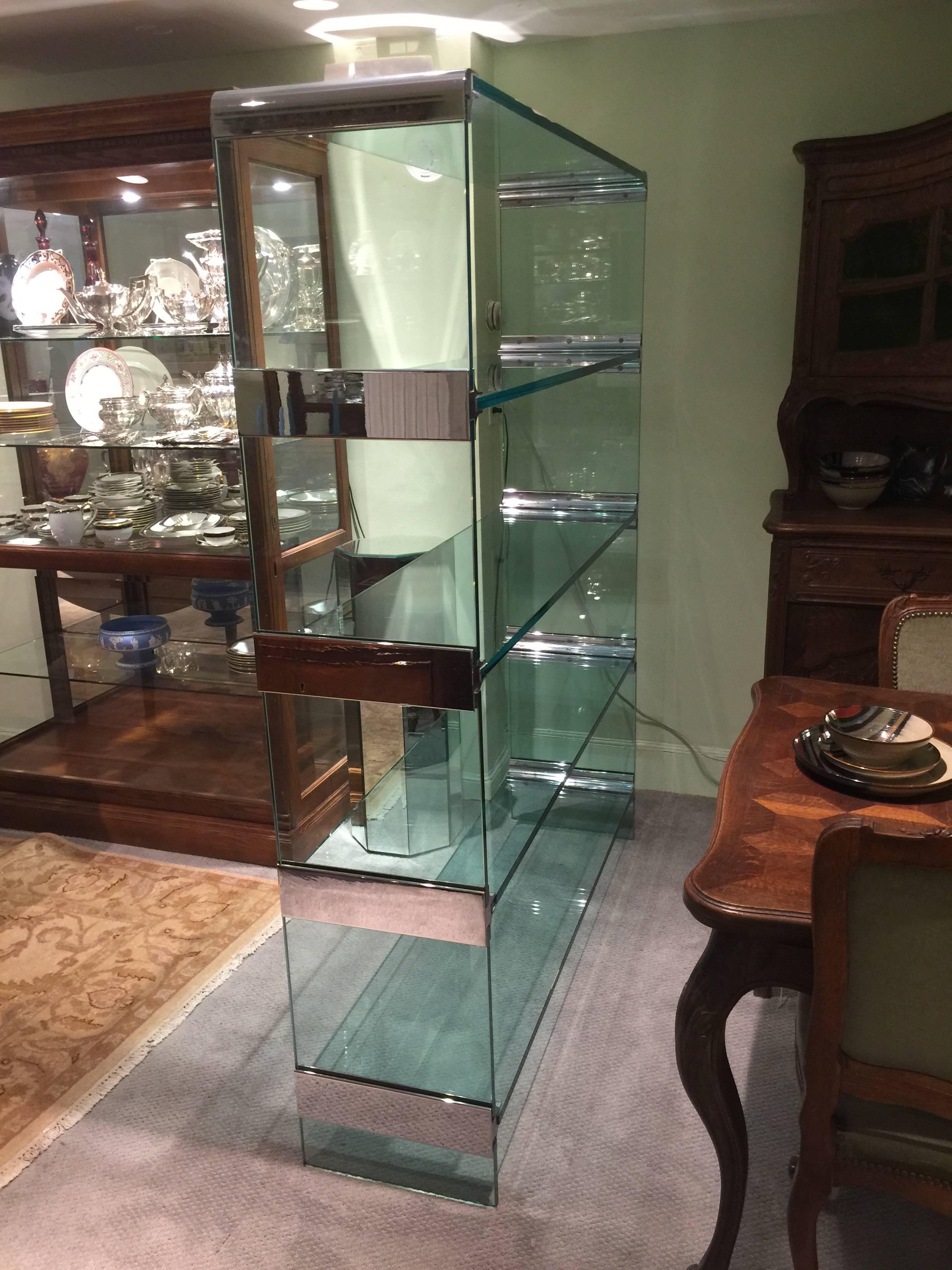 
Large glass and chrome Mid-Century Modern shelving unit by Pace, rare and probably custom-made.
The compartments have a 14 3/4