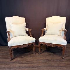 Pair of Early 19th Century French Louis XV Carved Walnut Fauteuil Armchairs