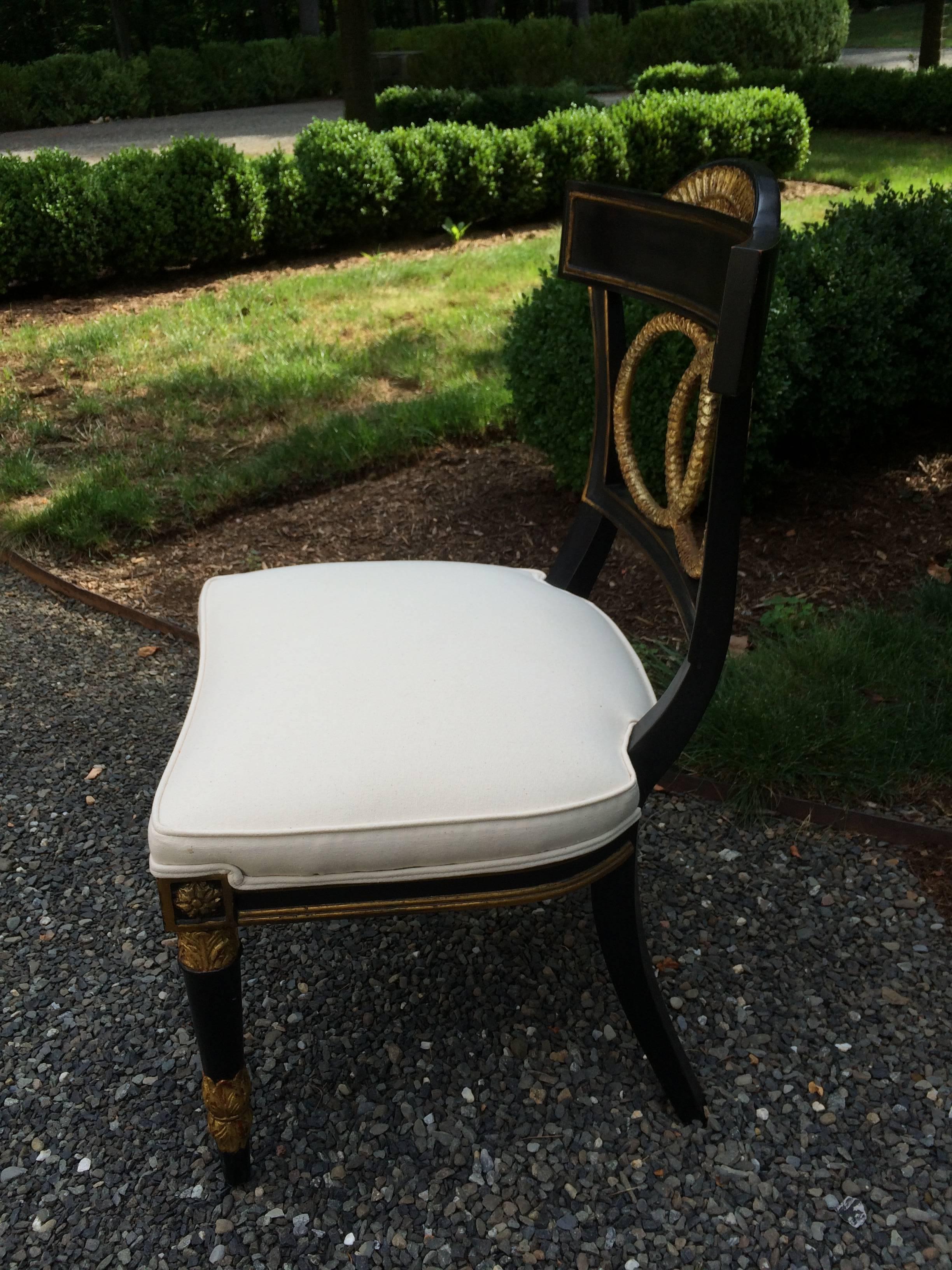 Elegant ebonized and gilt occasional or desk/vanity chair. Newly upholstered in white cotton fabric. USA, 1990, excellent condition. Measures: 17