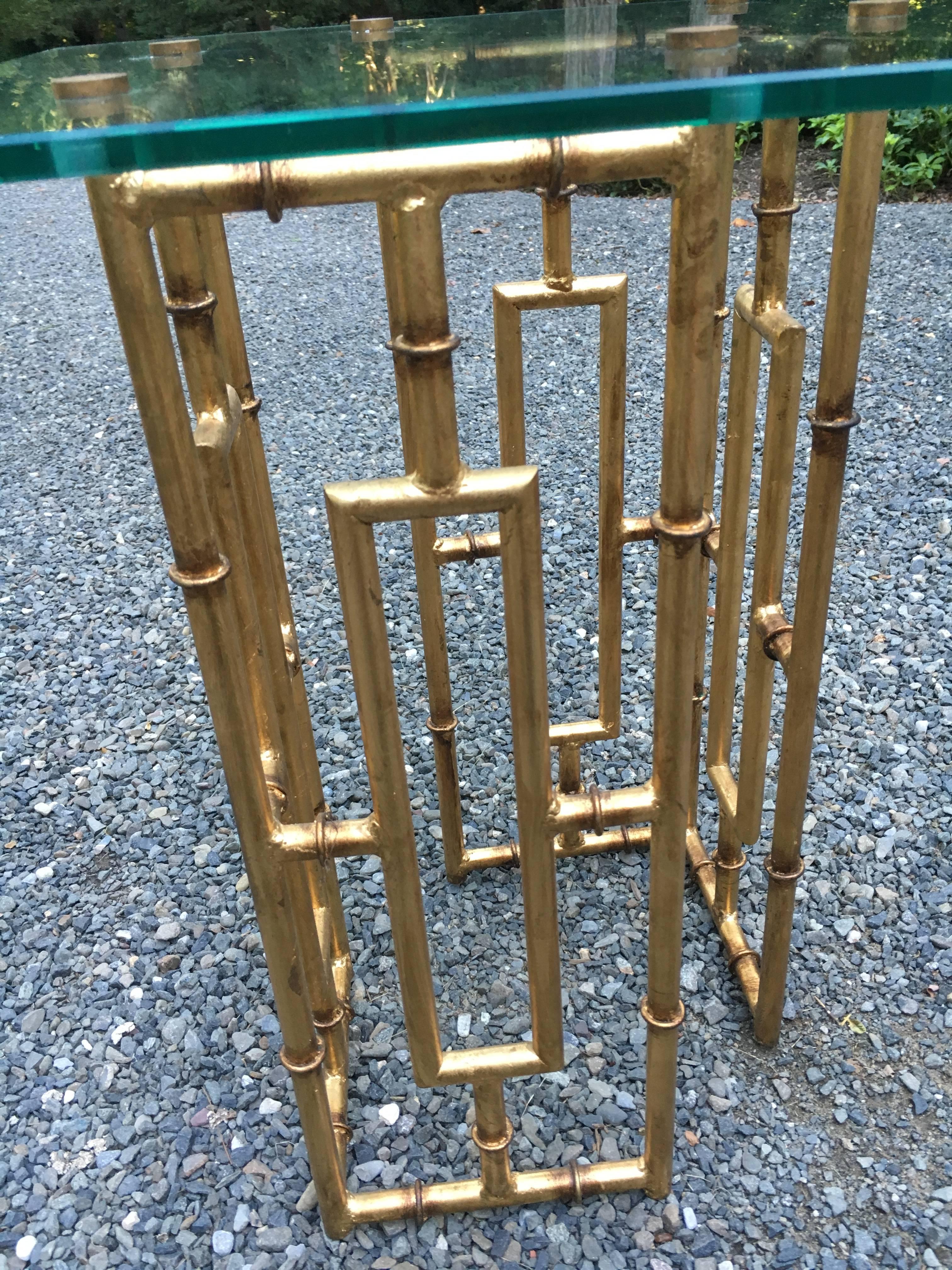 Chic pair of faux bamboo gilt base side tables with thick glass (attached) tops. Excellent condition, glass measures 3/8