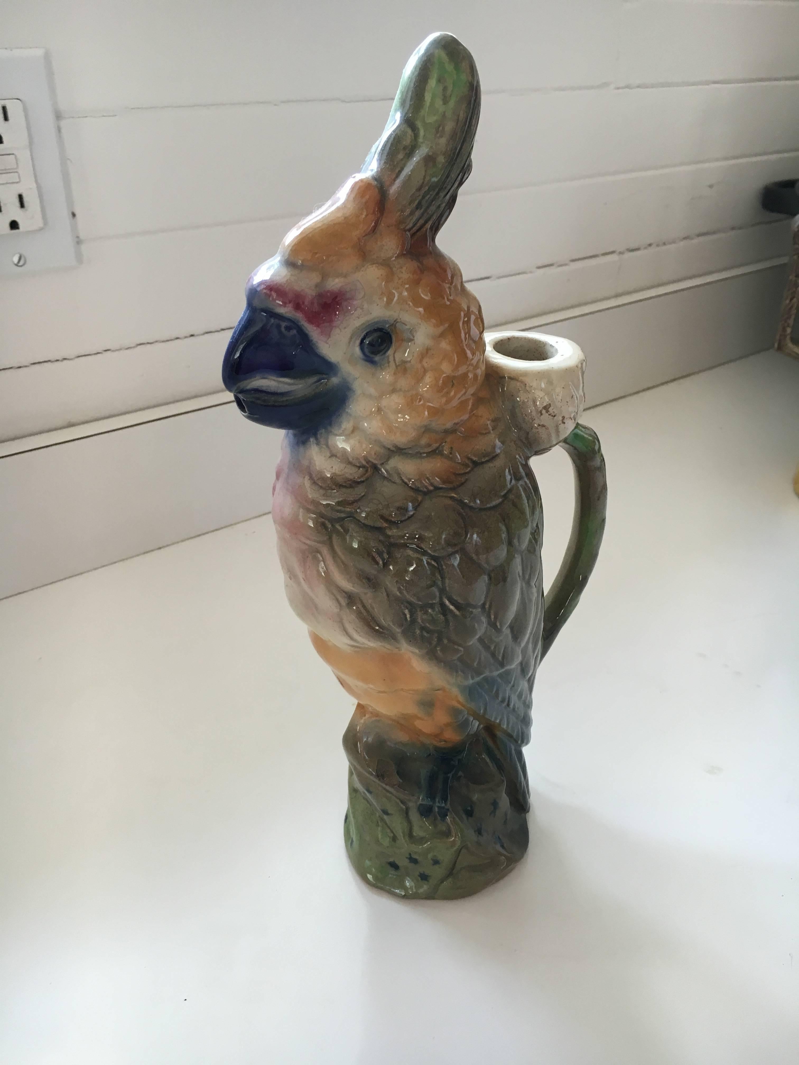 Mid-19th century lovely Majolica pitcher in the shape of a parrot. Makers mark is St. Clement on bottom and stamped 