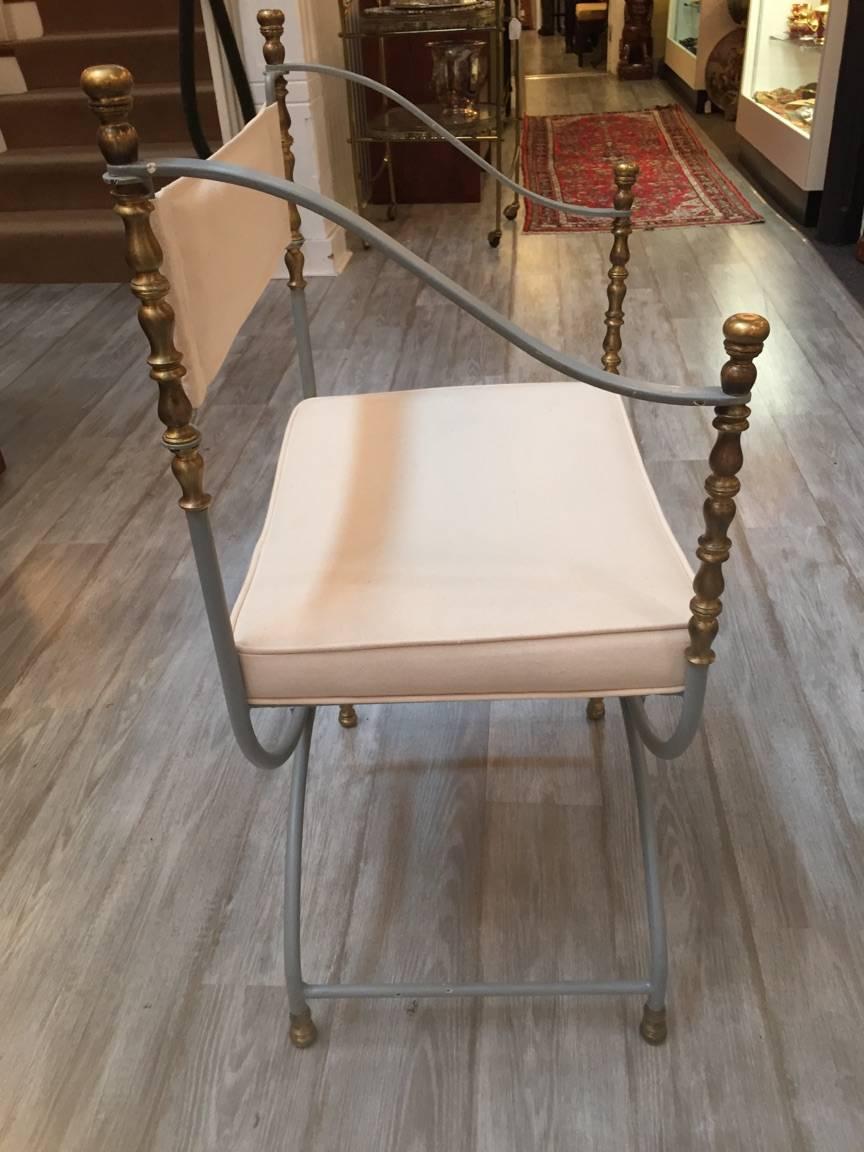 Elegant pair of zinc grey painted iron and brass Savonarola chairs with new white duck upholstery.