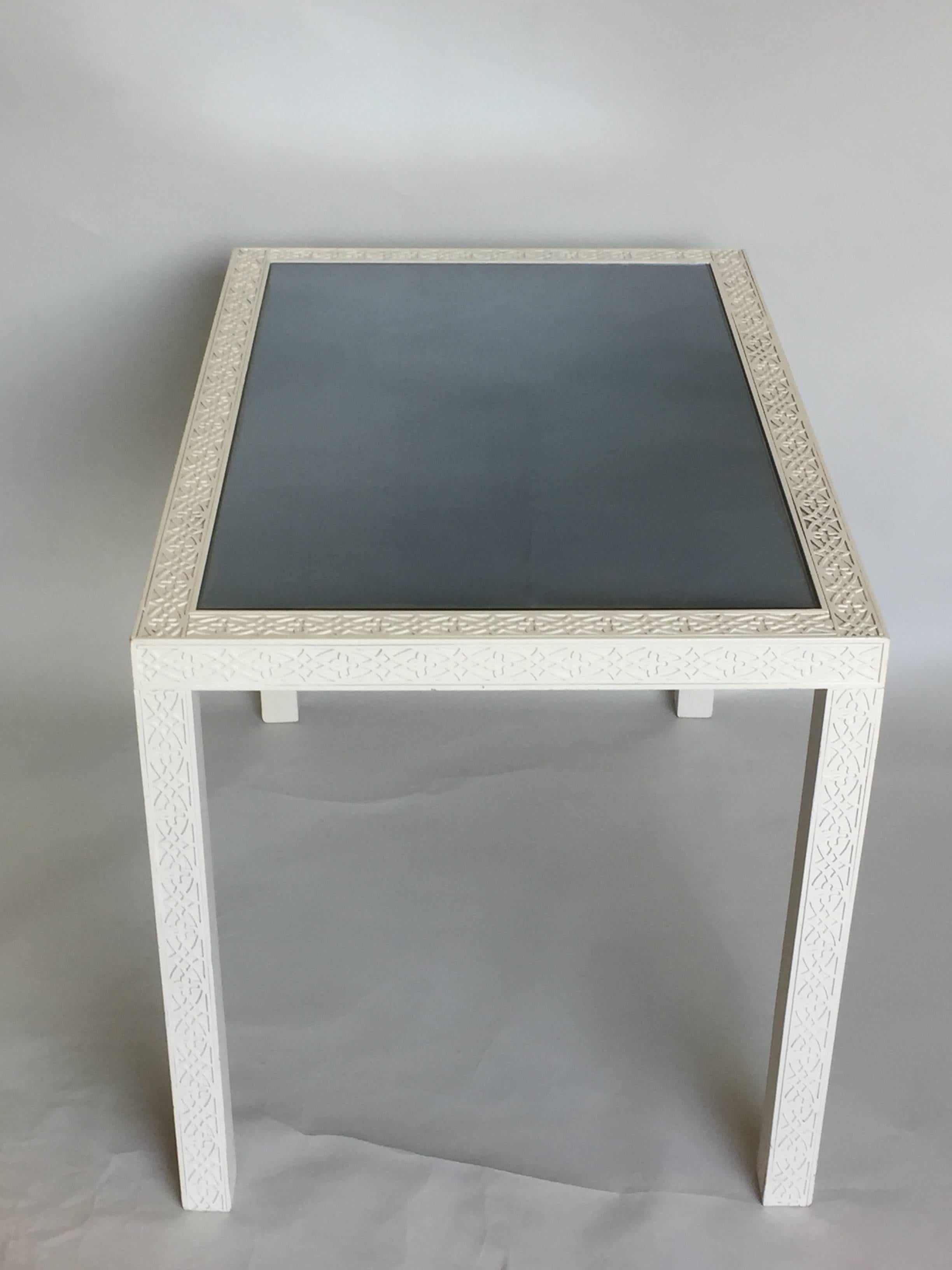 Elegant white Chinese Chippendale style end table or side table with decorative blind fretwork base and original mirrored top.
