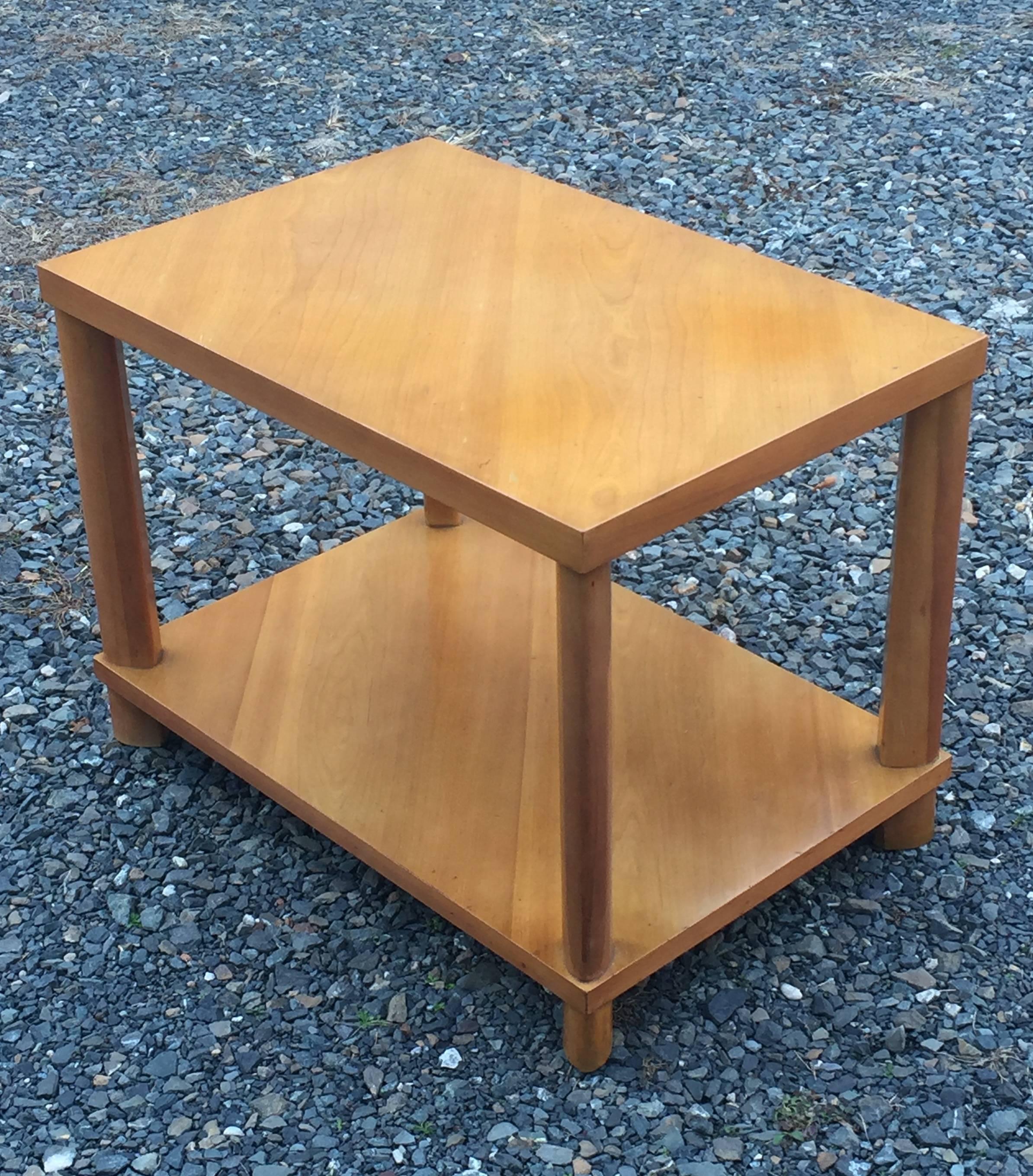 Classic Gibbings two-tier side table with oval dowel legs. Perfect proportions with bias cut top and lower shelf, simplified elegance. Honey colored walnut.