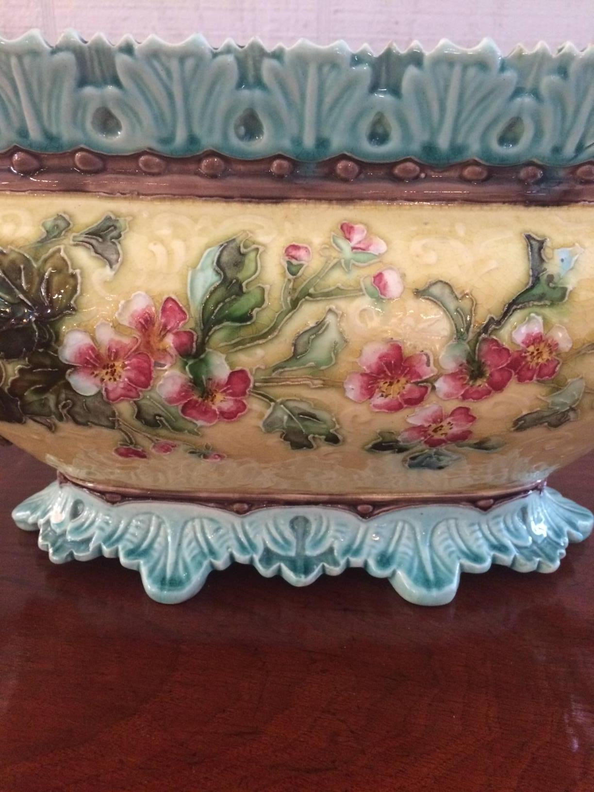 Gorgeous oblong Majolica centerpiece or planter in luscious soft yellow, celadon blue, pink and green flowers on one side and purple and green blossoms on the reverse. L 13 is marked on the bottom.