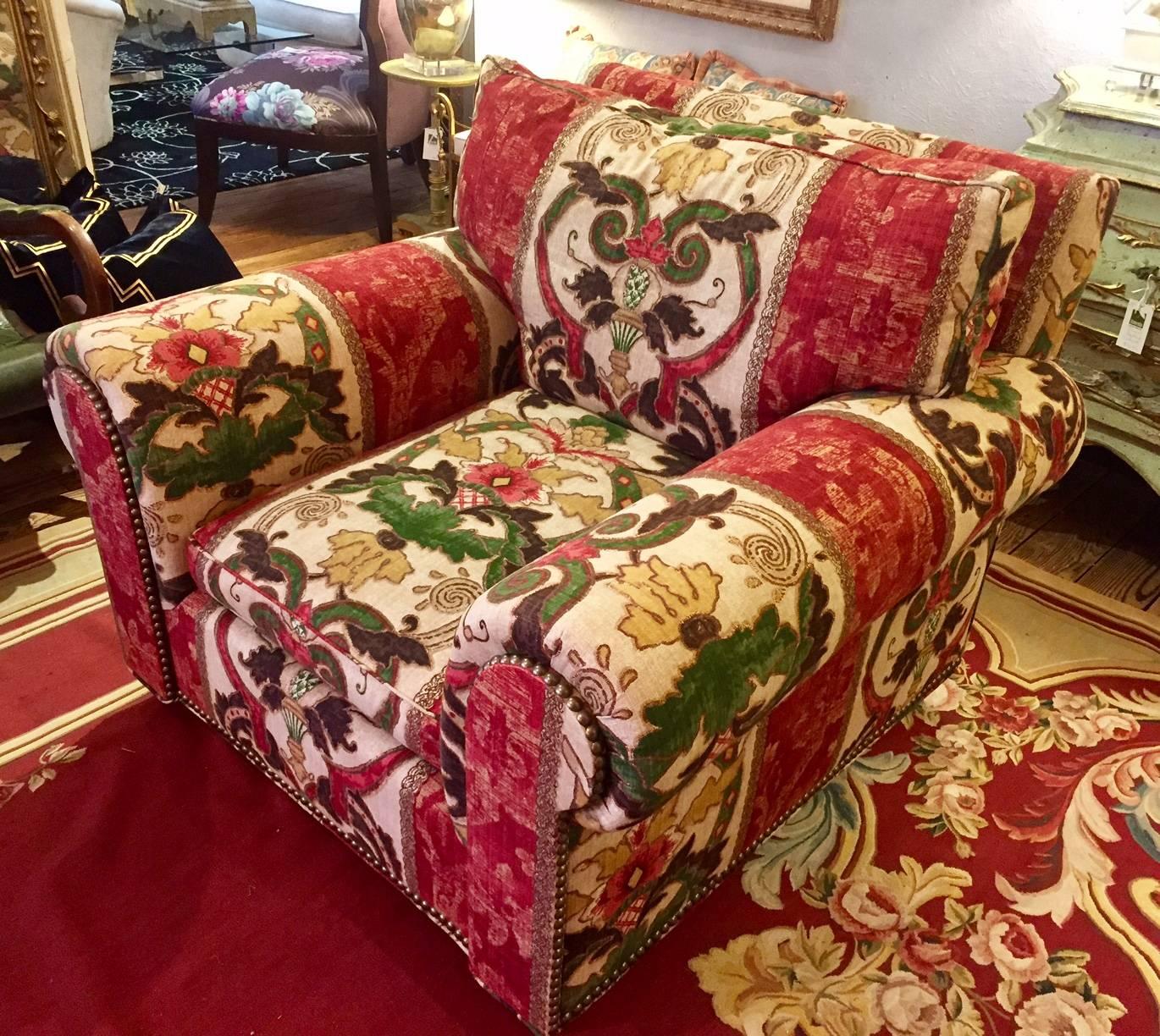 Two heavenly sumptuous club chairs, oversized and unbeliveably comfy, attributed to George Smith. No label, but from a top drawer designer on the main line. Gorgeous tapestry like fabric in jewel tones of maroon, green, cream and gold.