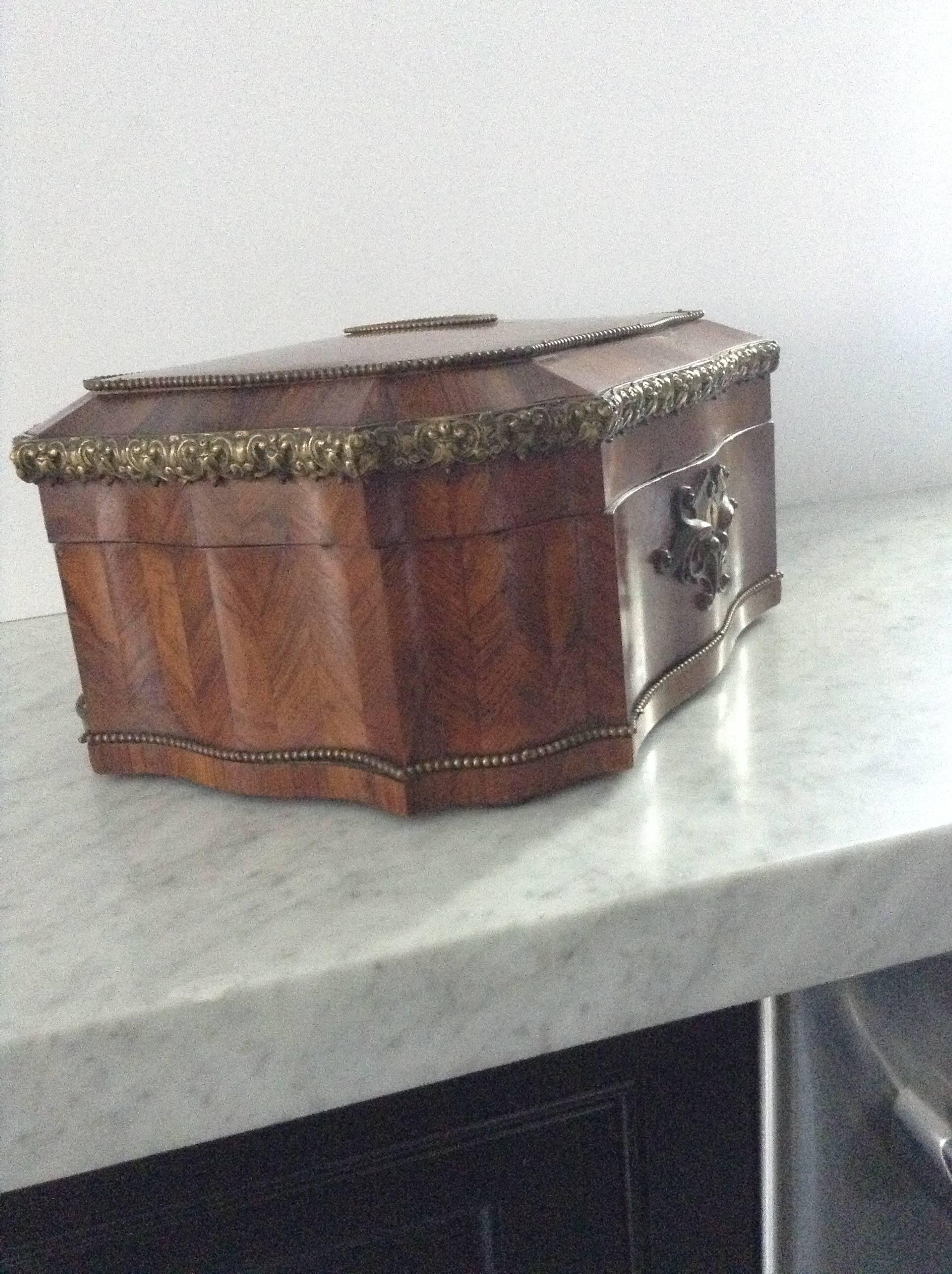 Gem of an antique French marquetry jewelry box with mirrored medallion on top. Brass beading adorns all edges of the box. Patina and grain of wood are superb. Excellent condition on exterior. Interior needs relining, if desired.
 