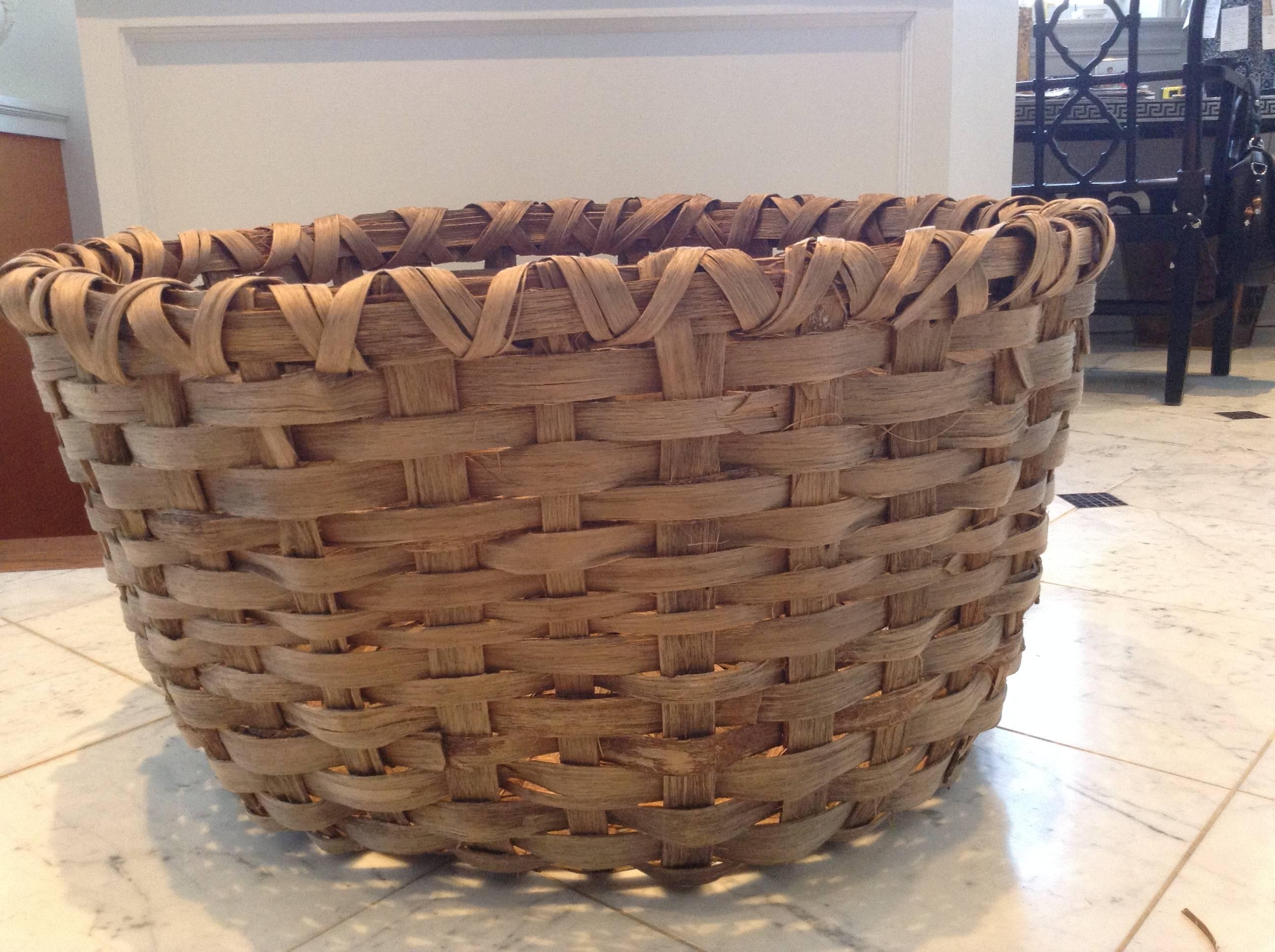 Monumental antique woven splint basket measuring 38