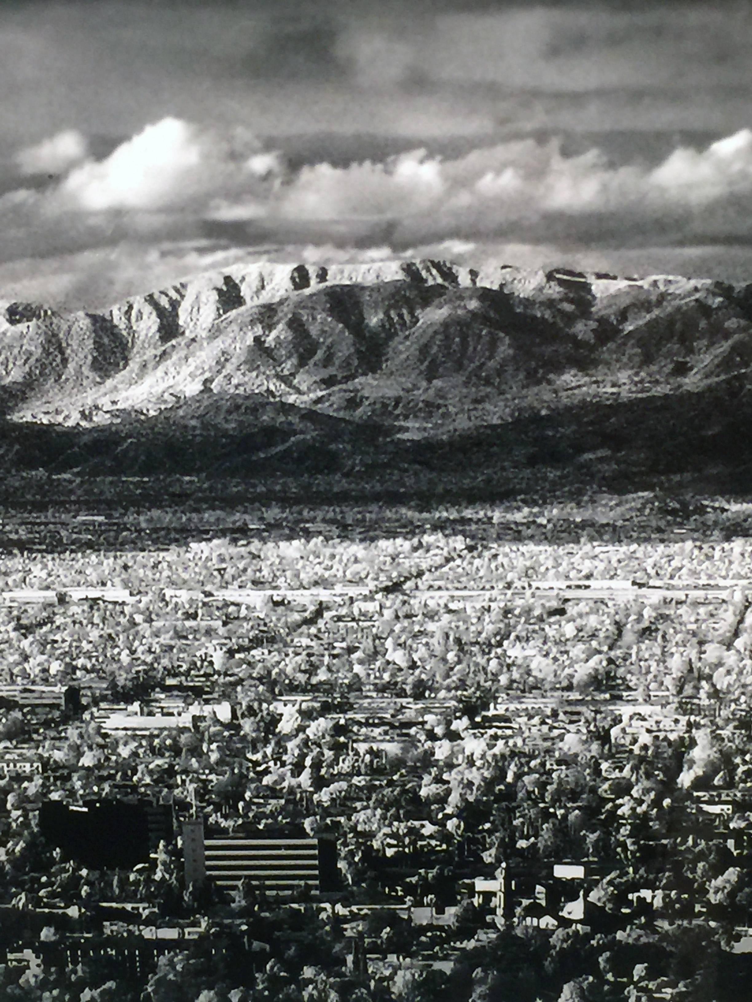 A large black and white framed photograph by Mitch Dobrowner 
titled 