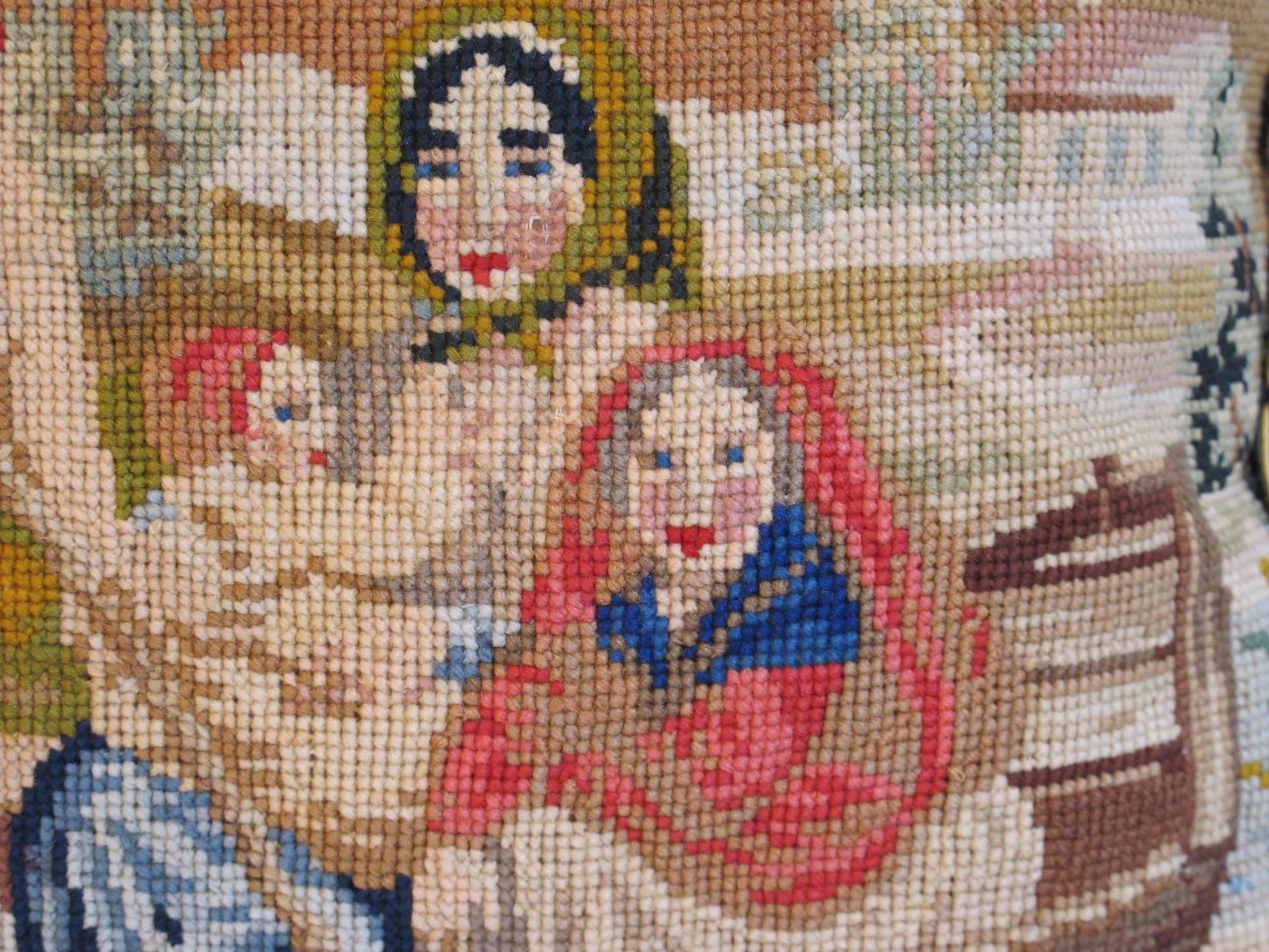 A pillow made from a circa 1880s needlepoint tapestry depicting a charming scene of children boating, embellished with vintage coordinating multicolored tassel fringe,
Measures: 14