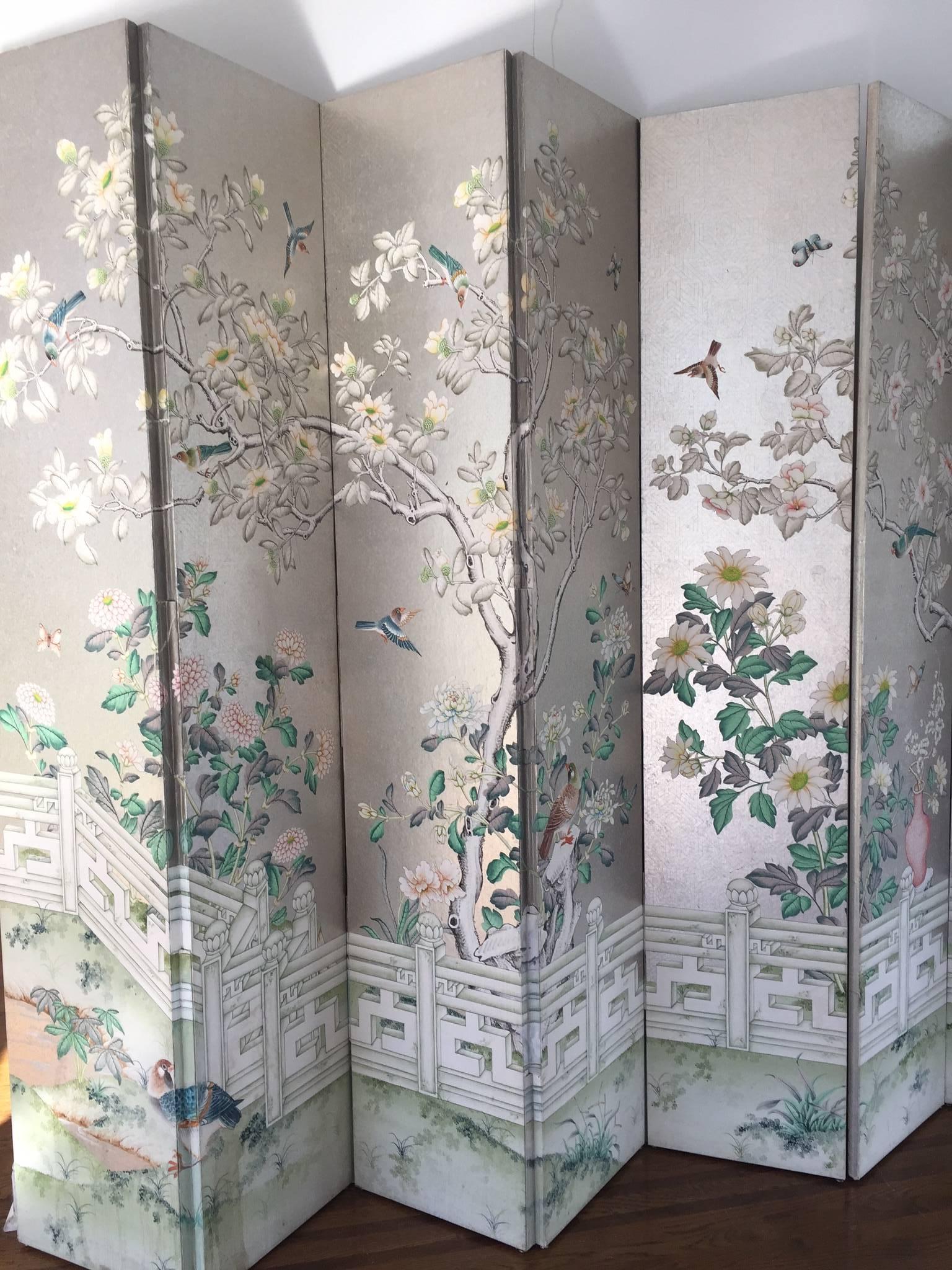 A breathtakingly tall five-panel super glamorous screen, hand-painted with metallic silver background and adorned with an Asian inspired garden scene having foliage, birds, butterflies and lattice fence at the bottom.
Each panel is 92 H x 17.5