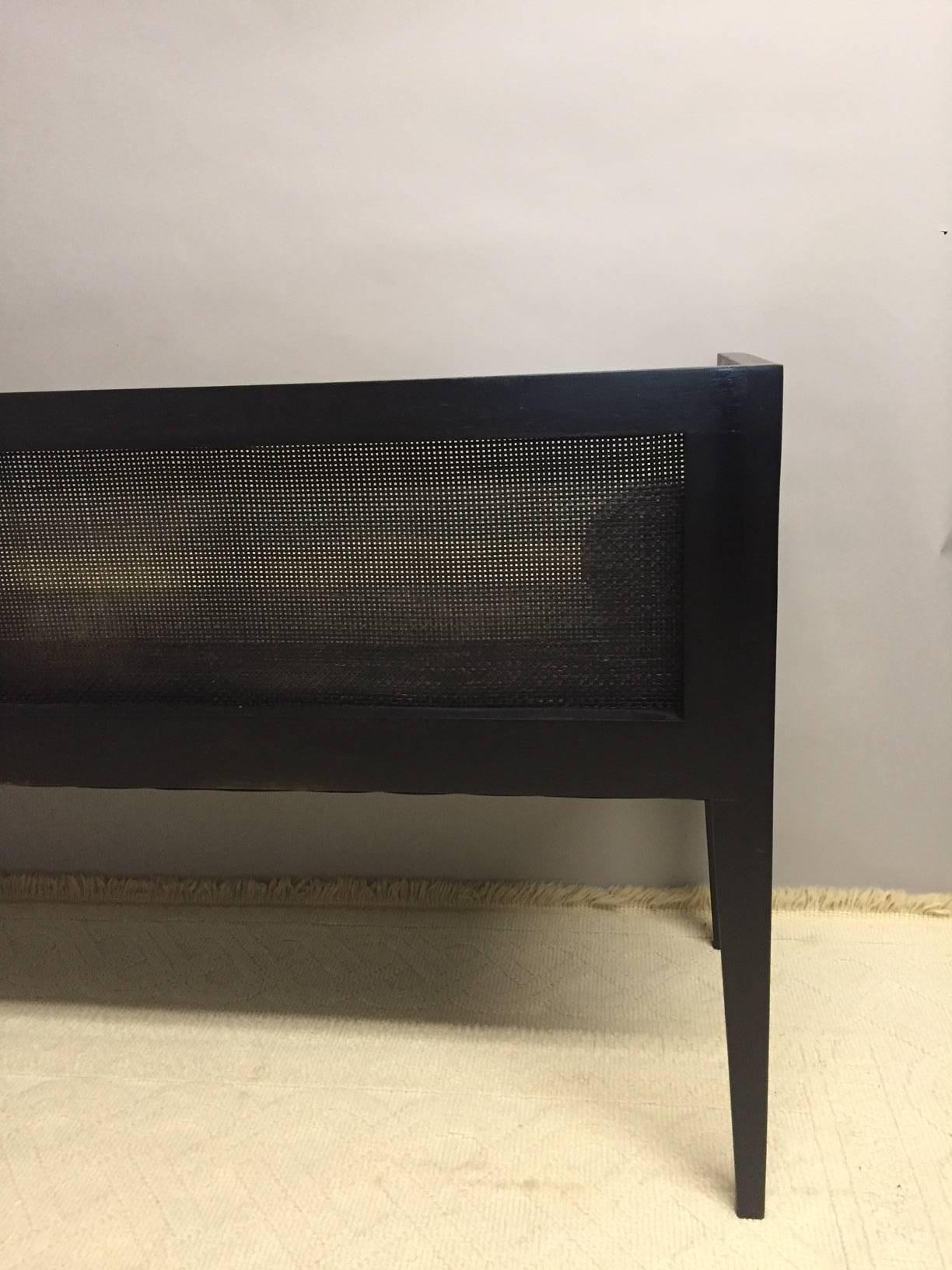American Ebonized and Caned Bench with Linen Cushion