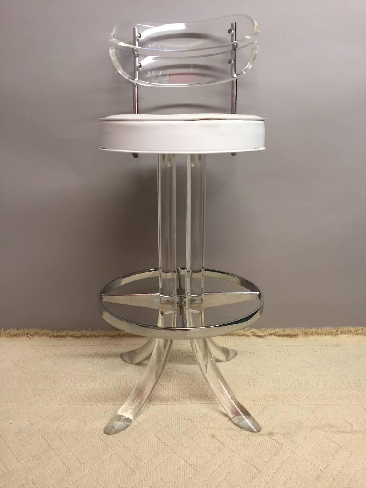 Two cool Lucite and chrome barstools with original white vinyl upholstery, by Hills Manufacturing Co.