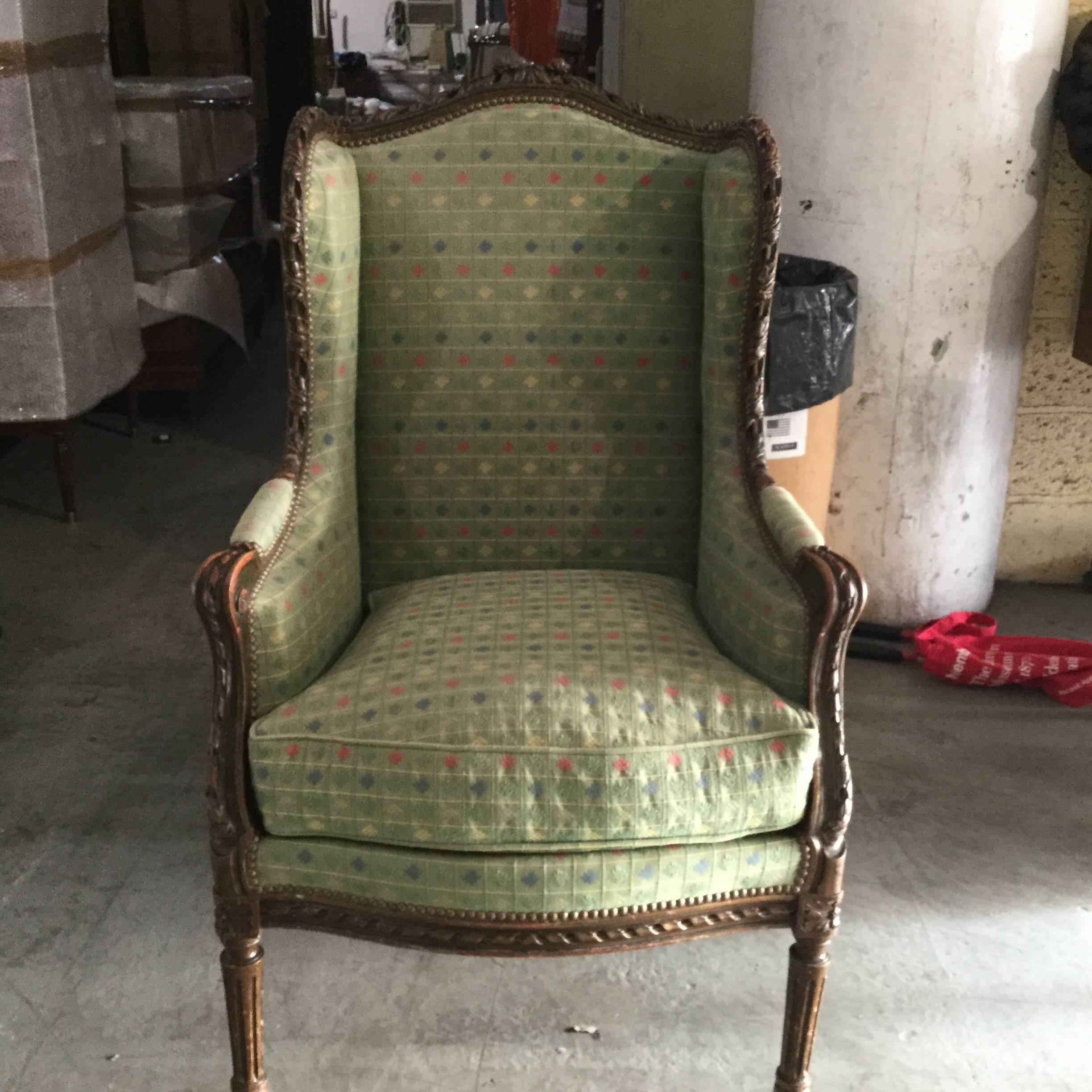 French Louis XVI-style bergere having a beautifully carved frame with a polychrome finish. The heavy cotton upholstery is green with a subtle check pattern and is new.
Measures: Height to arm: 26.
  
