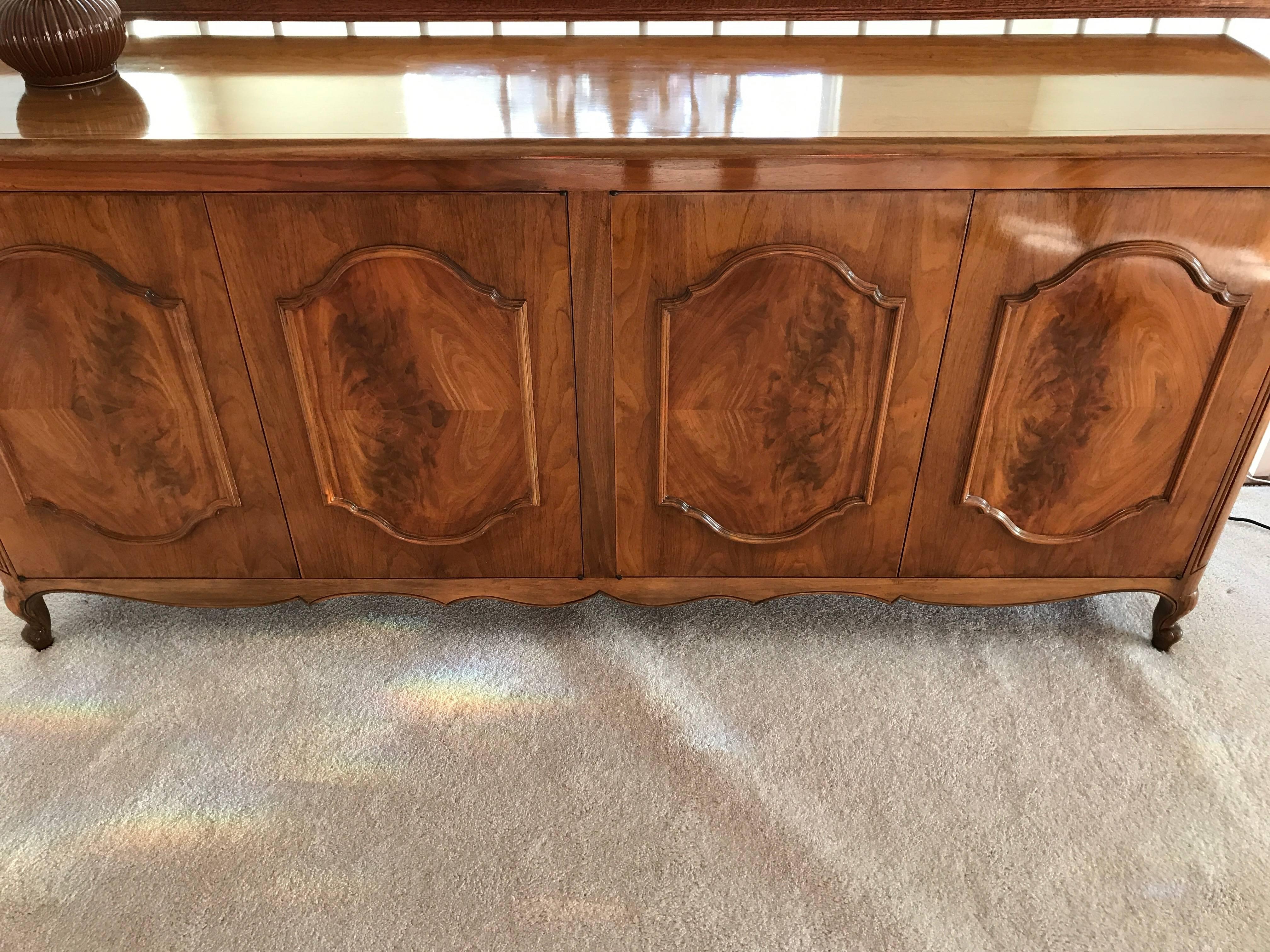 Very elegant solid walnut and satinwood sideboard with lively beautiful grain, and lots of storage inside.