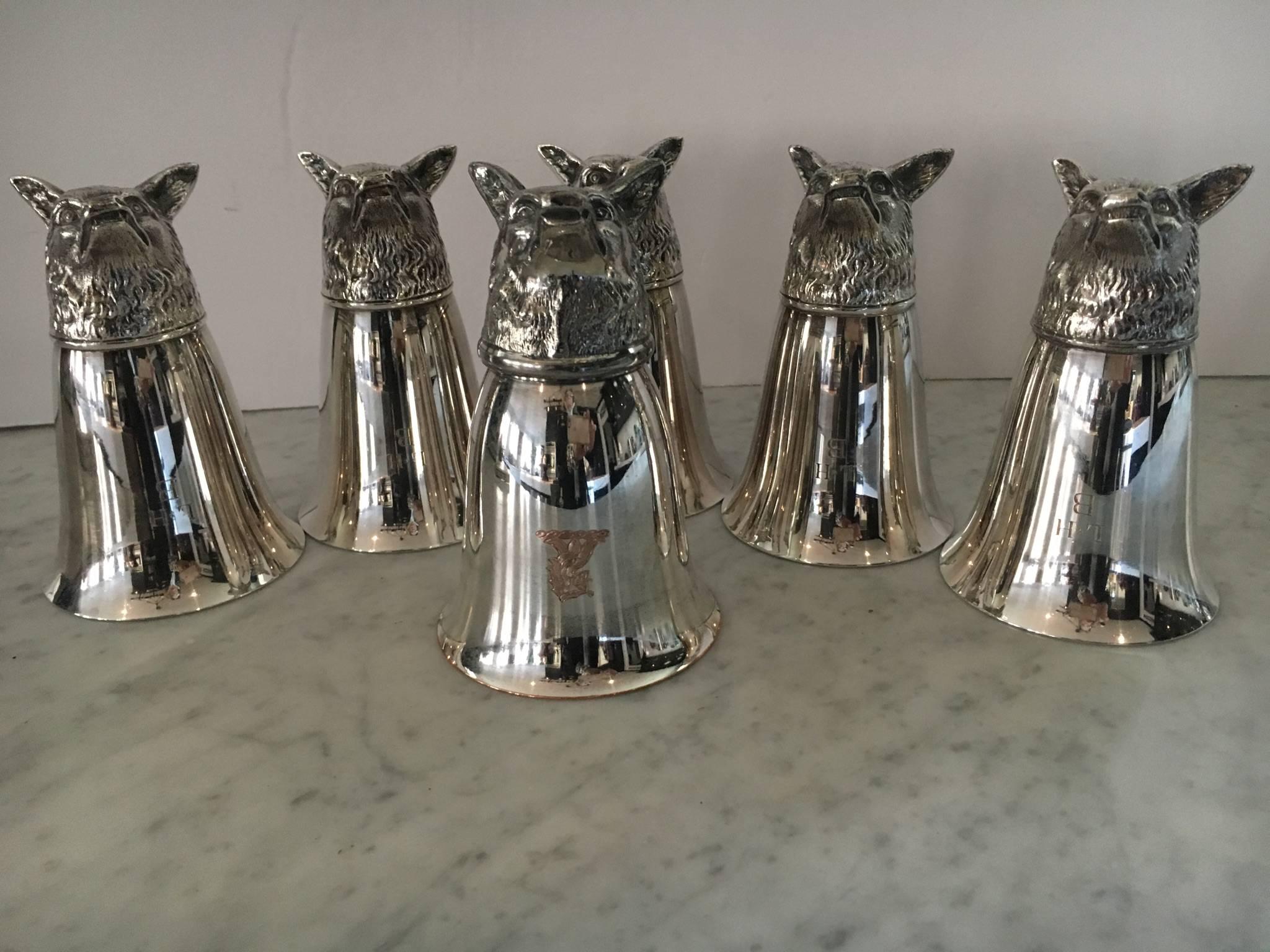Handsome set of six Gucci style fox stirrup cups. Great tabletop objects and perfect for the hunt or parties. Cups flip over for serving drinks and are very sturdy. Five are monogrammed LHB and one has a family crest. One cup has a small copper spot