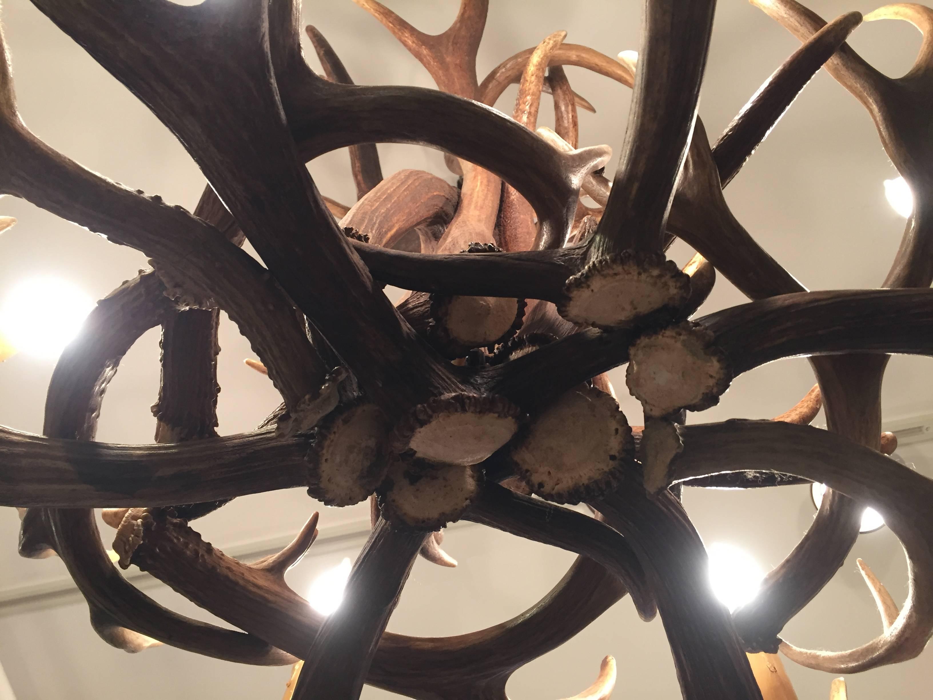 Large beautifully handcrafted rustic antler chandelier, purchased from a collector who actually got the antlers while on safari in South Africa.