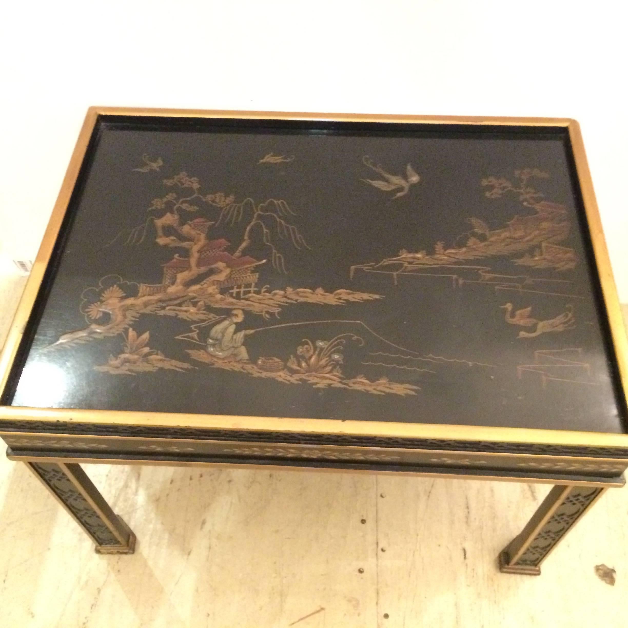 An elegant black and gold end table having gold outlining and chinoiserie style decoration on 1/2 inch recessed top.
 