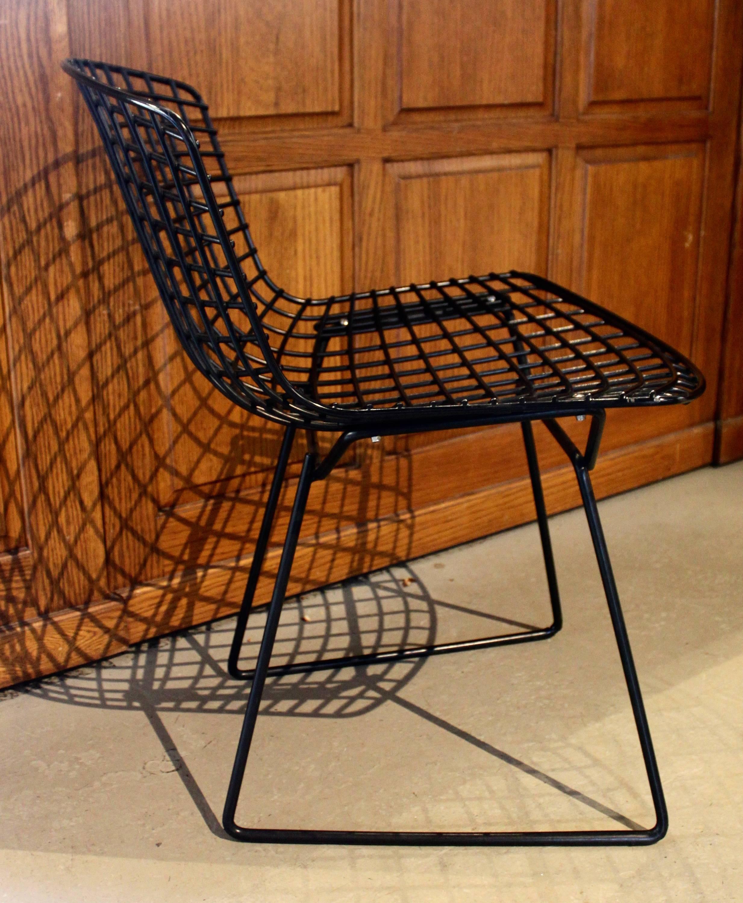 Bertoia side chairs by Knoll. Bottom of the feet shows wear. 