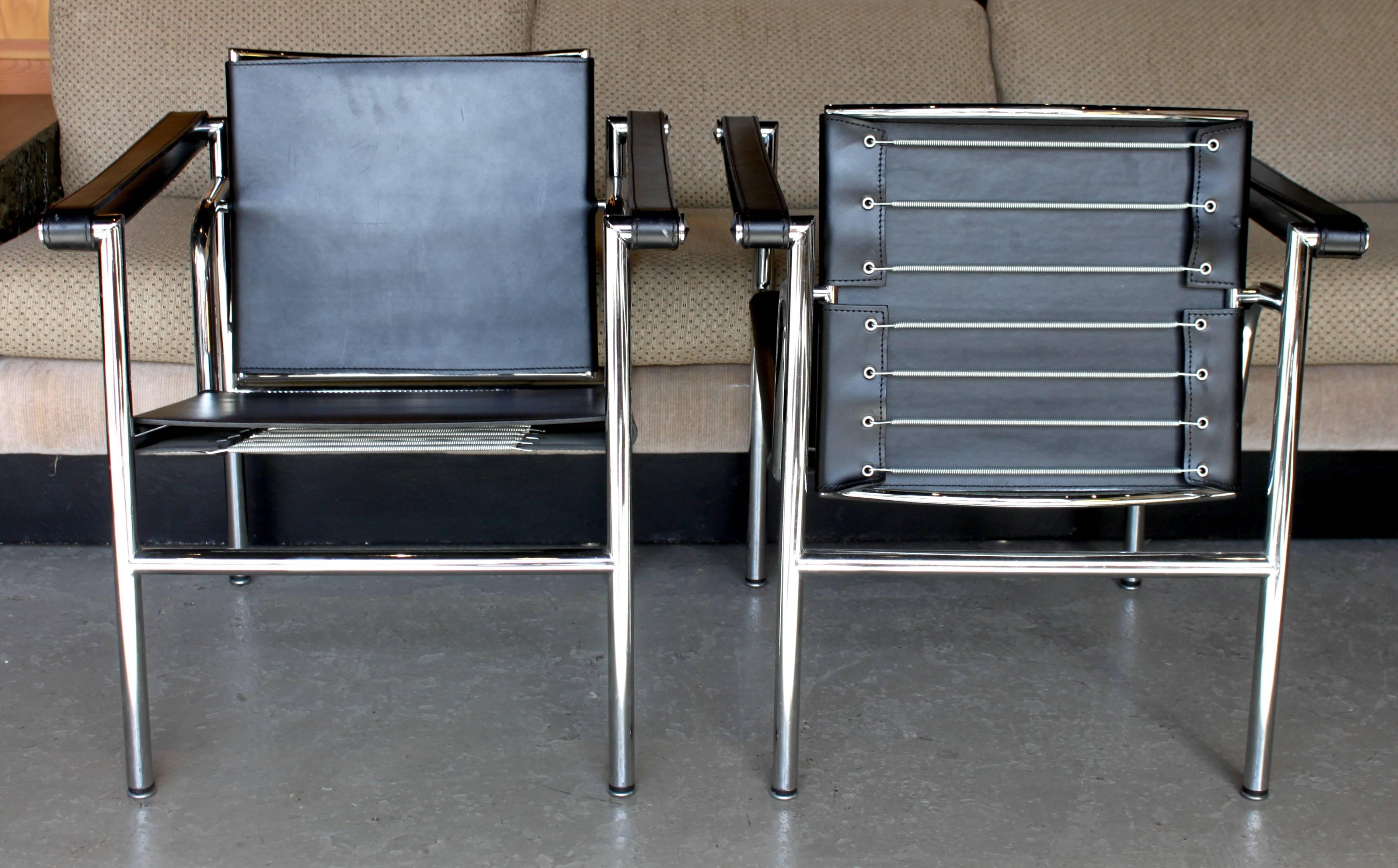 Pair of LC1 sling chairs designed by Le Corbusier, Charlotte Perriand and Pierre Jeanneret.