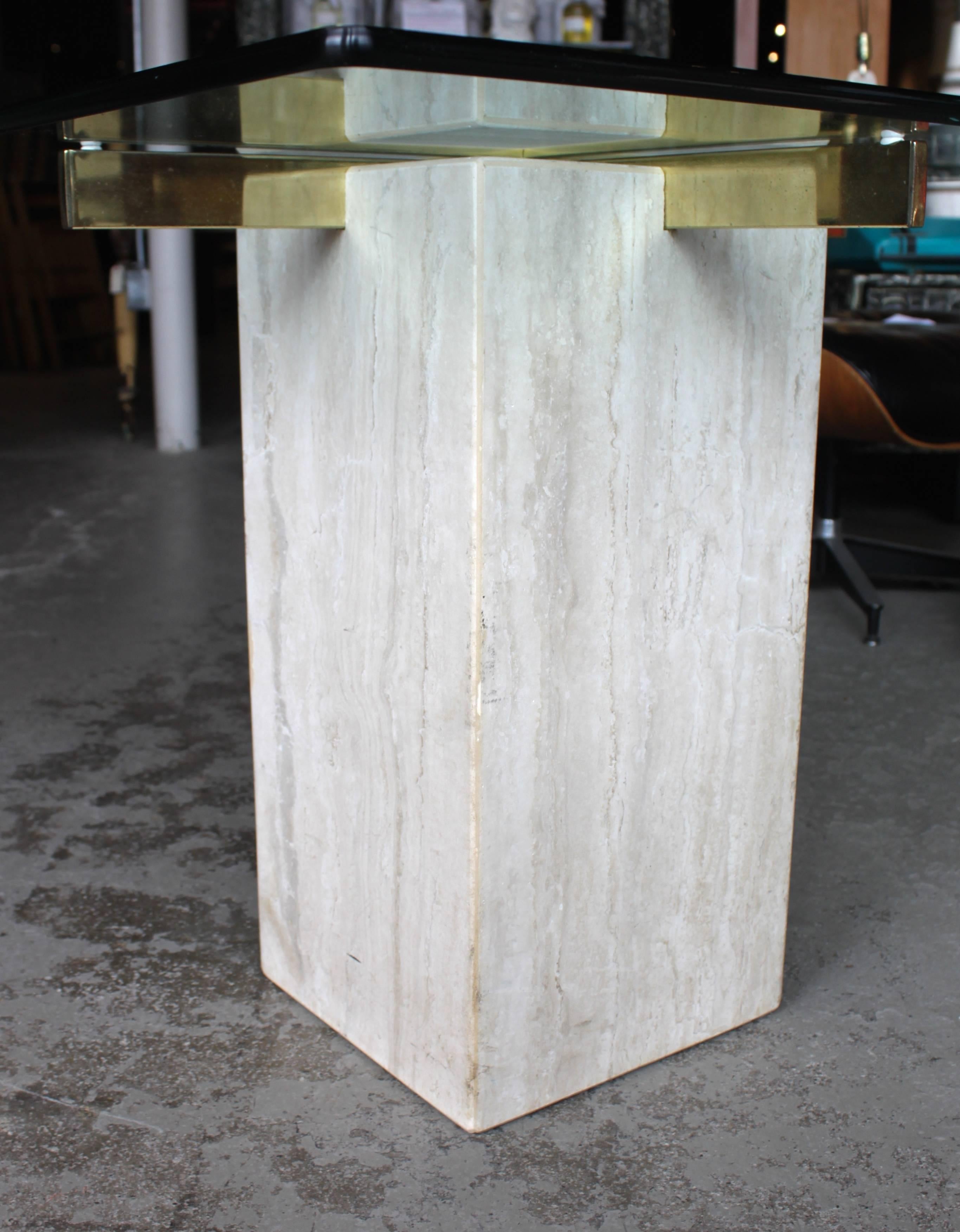 Travertine marble base glass top Artedi style end table. In beautiful vintage condition with wear to finish and glass top consistent to age and use.