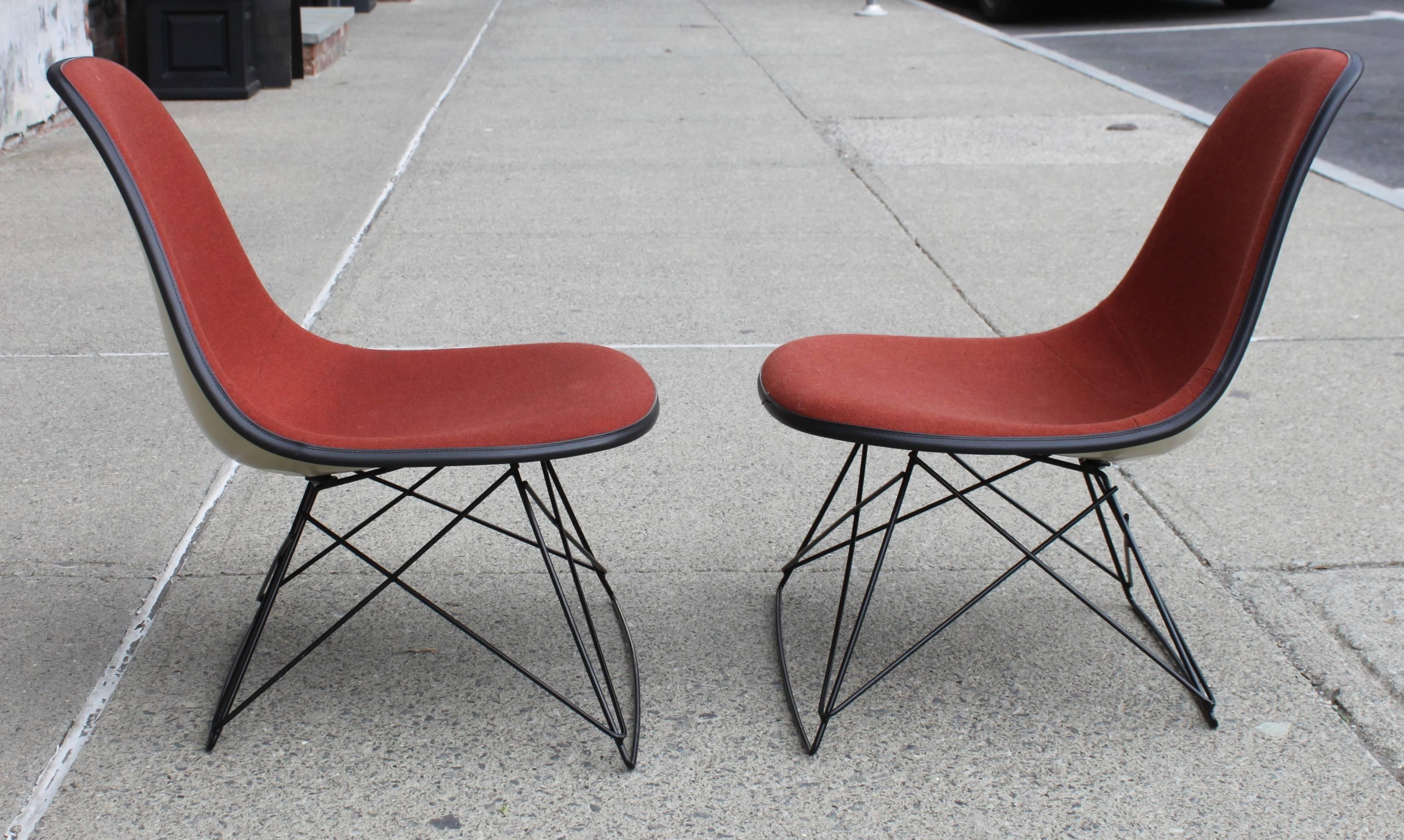 Herman Miller cat cradle base side chairs.