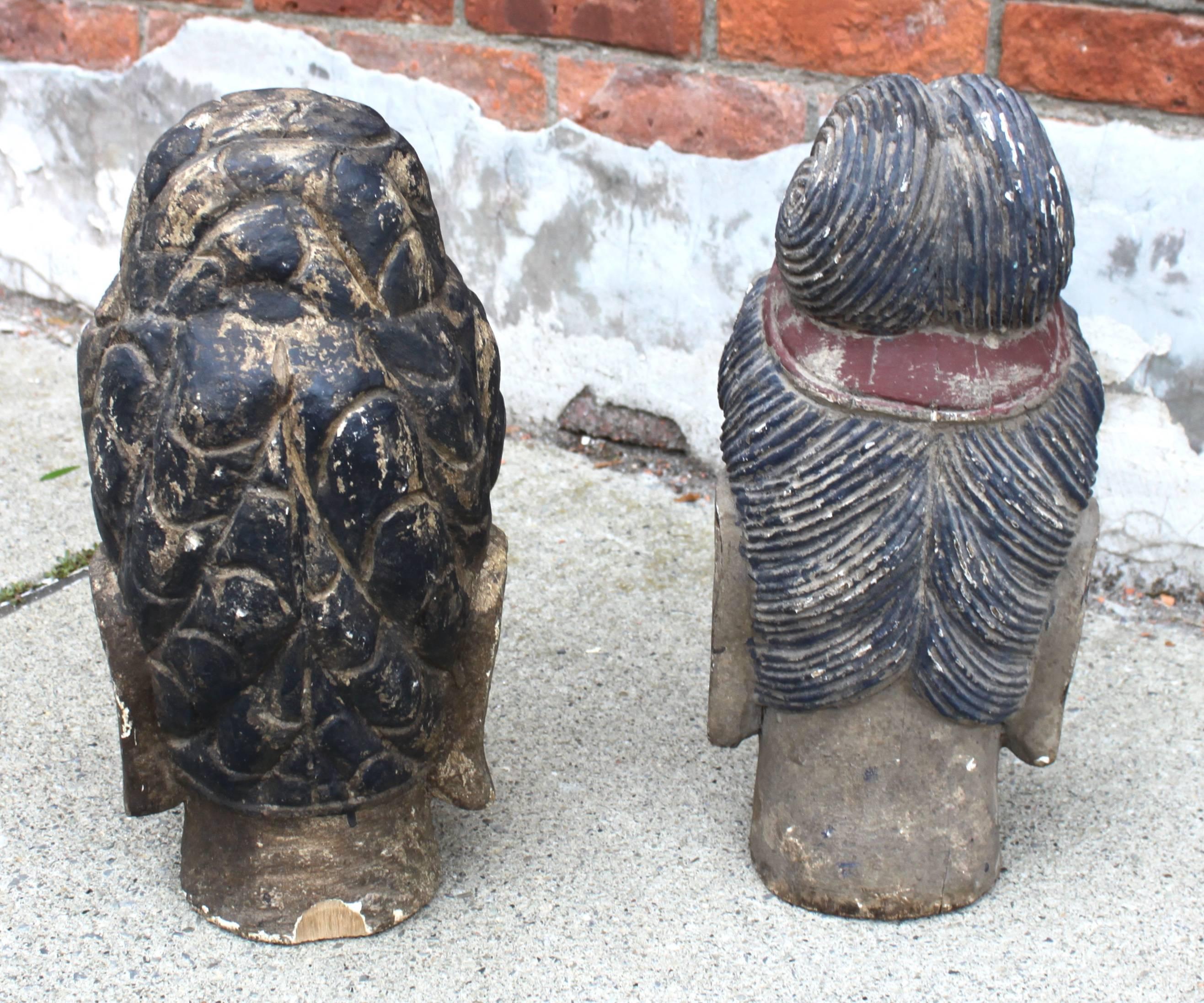 Pair of carved wood polychrome Chinese heads.