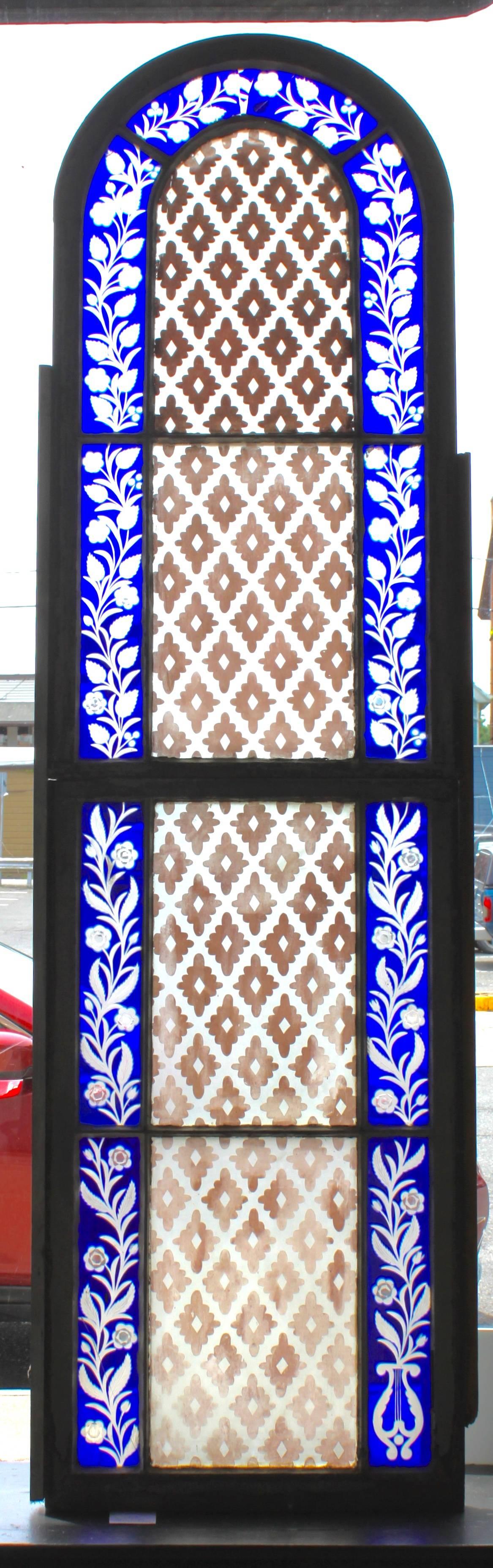 Beautiful Gothic revival windows with etched stained glass and stenciled glass panes.