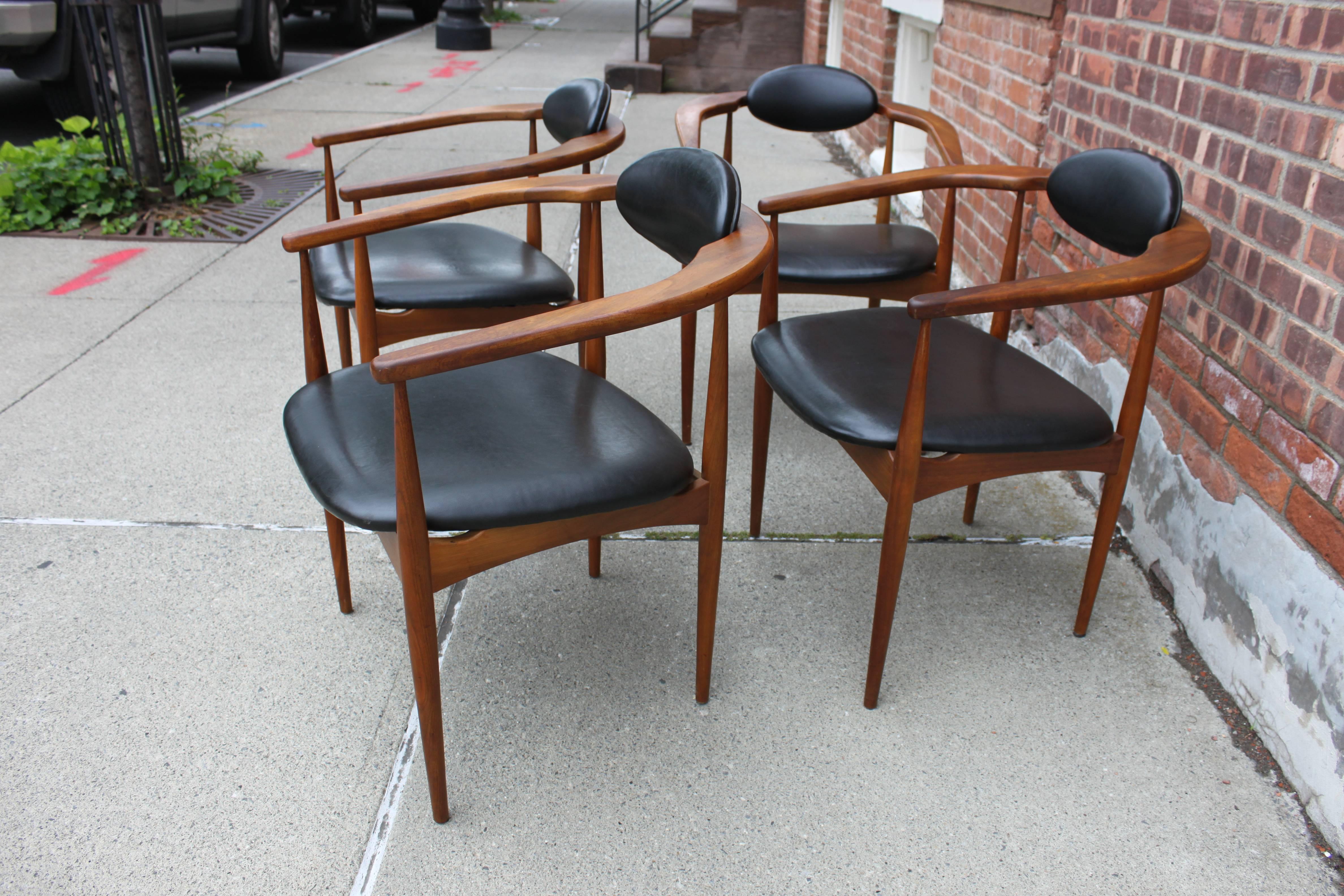 Rare and hard to find. Set of Model 950-C chairs by Adrain Pearsall. Black vinyl seat and back on solid walnut frame.
   