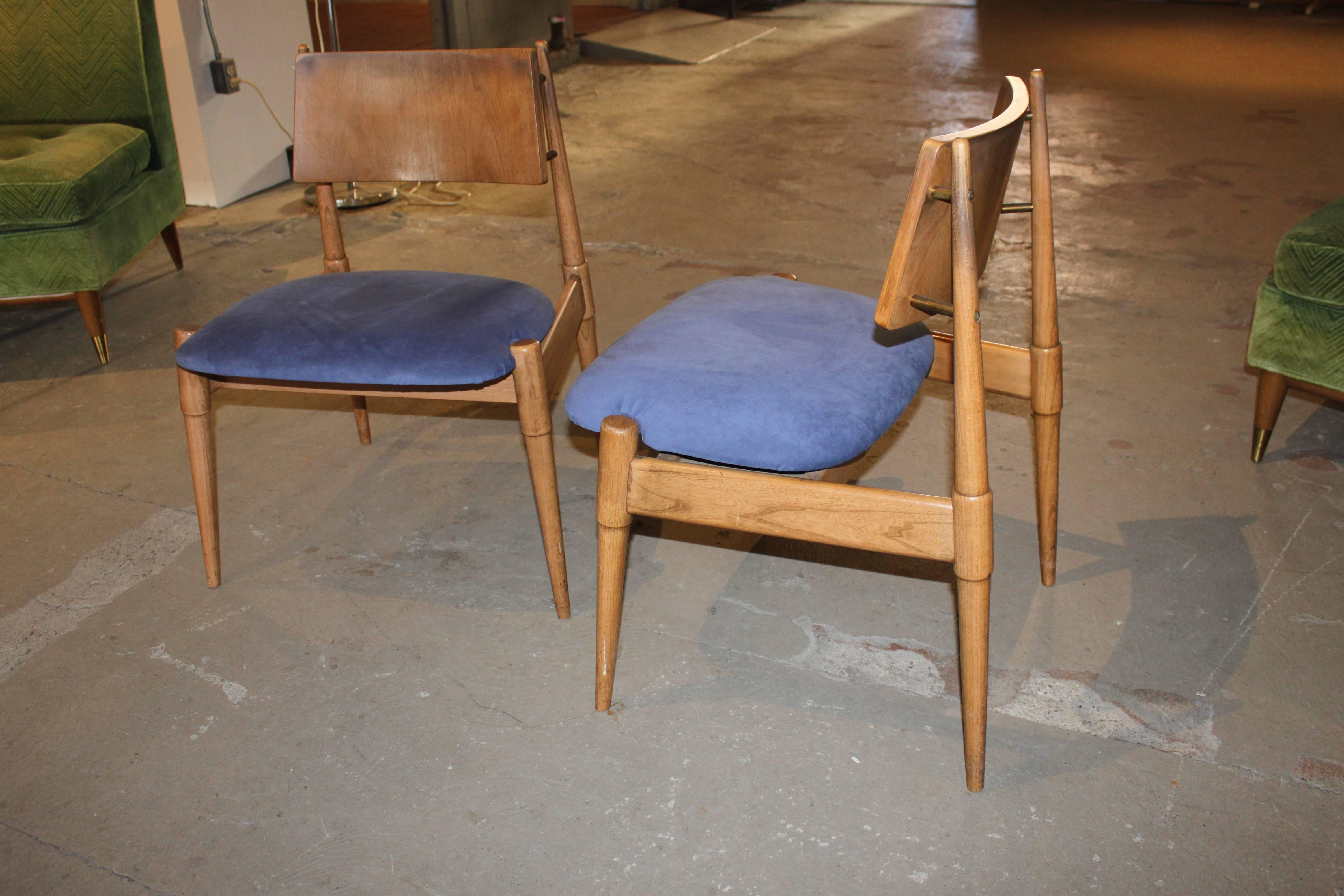 Two identical unusual Mid-Century Modern chairs.  Great looking and unique.  Seats have been re-upholstered in ultrasuede.  Frames have stains and scuffs consistent with age and use.  We also provide re-finishing service for additional cost.
Seat