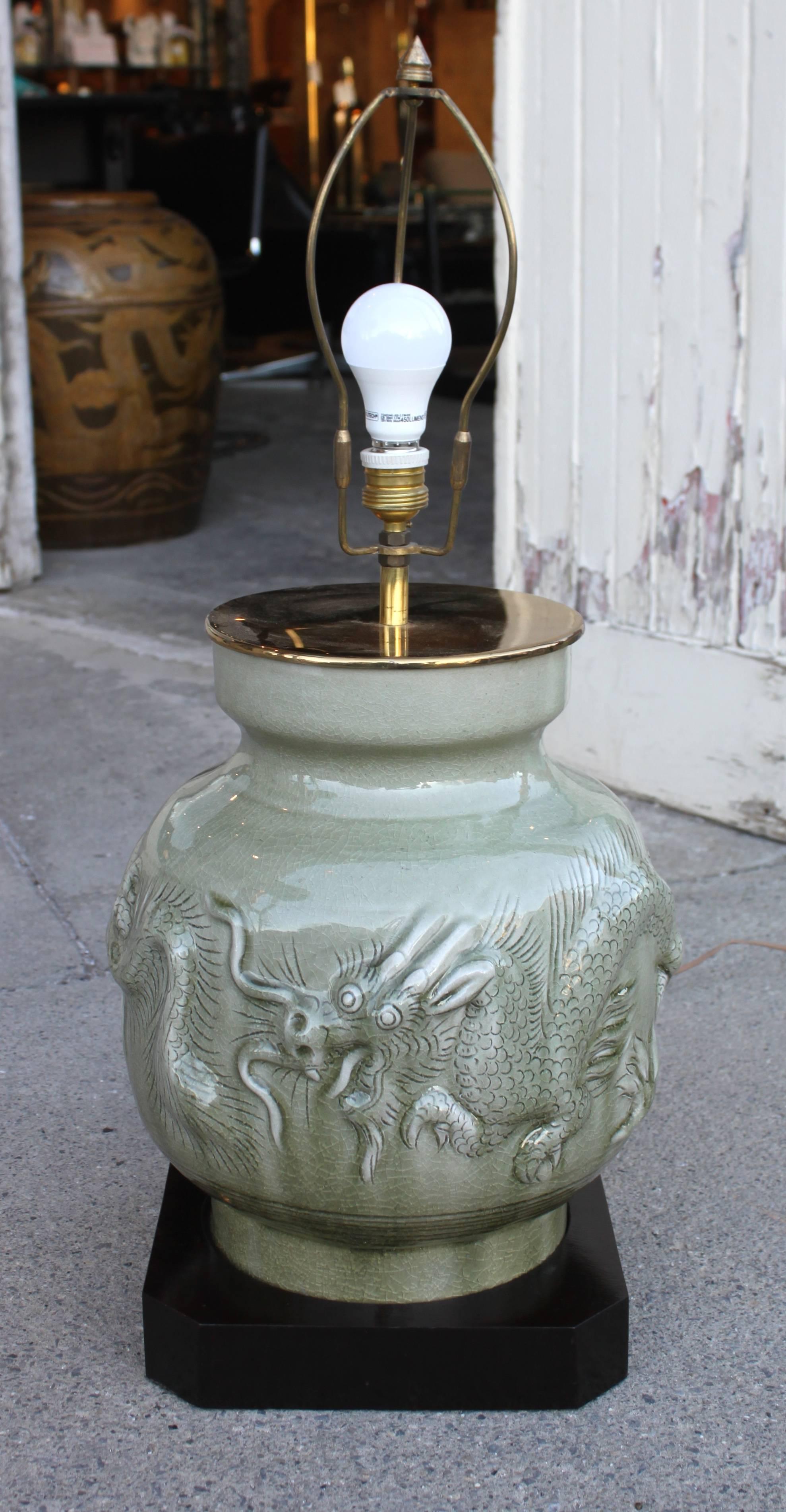 Vintage celadon dragon lamp with silk shade. High quality piece set with brass fittings.
