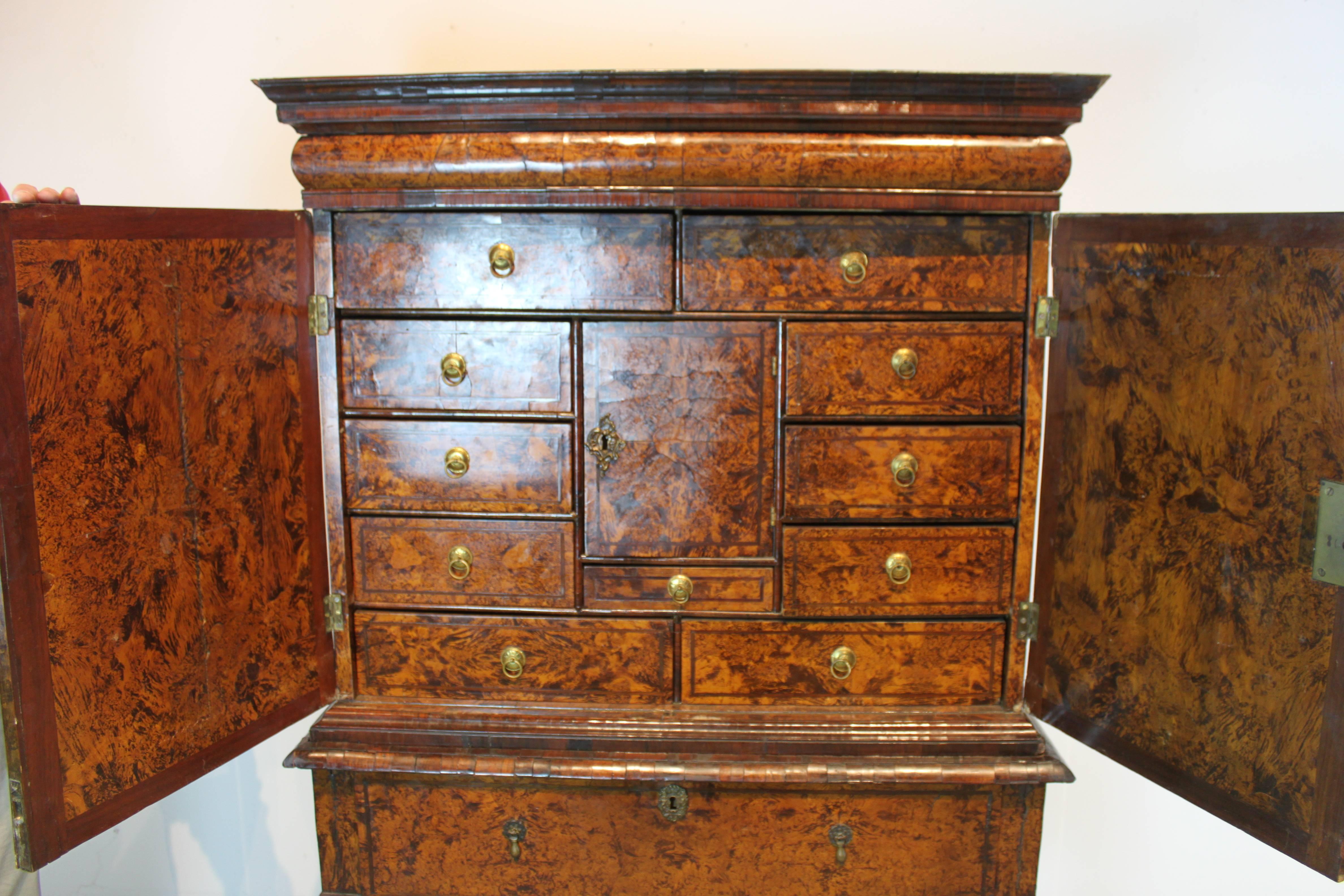 This rare and unusual William and Mary cabinet is made mulberry burl wood and grain paint. In the style of Coxed and Woster, London.