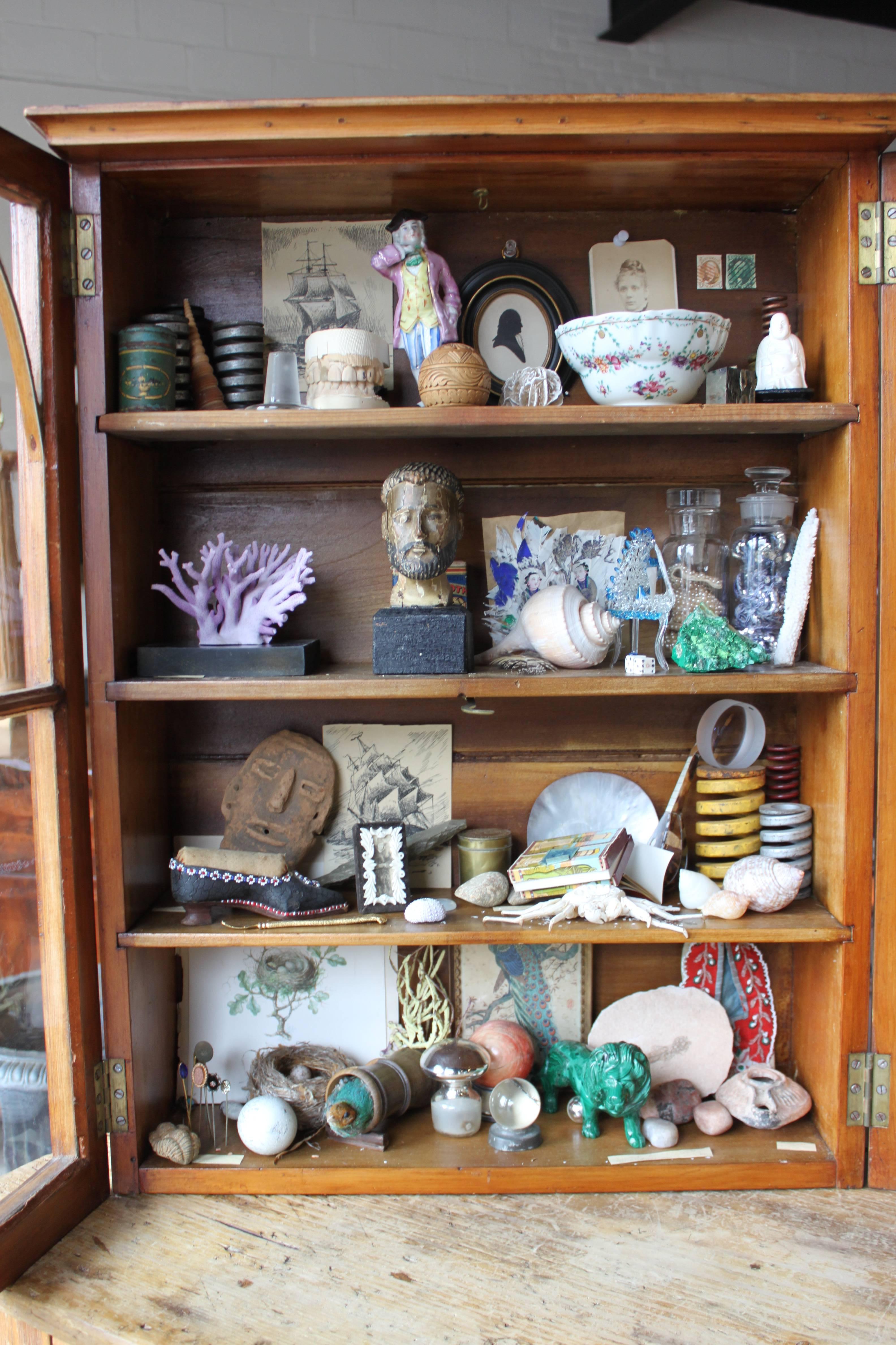 Curiosity cabinet #1 created by Keith Funston. 70 objects collection from various era and genre.