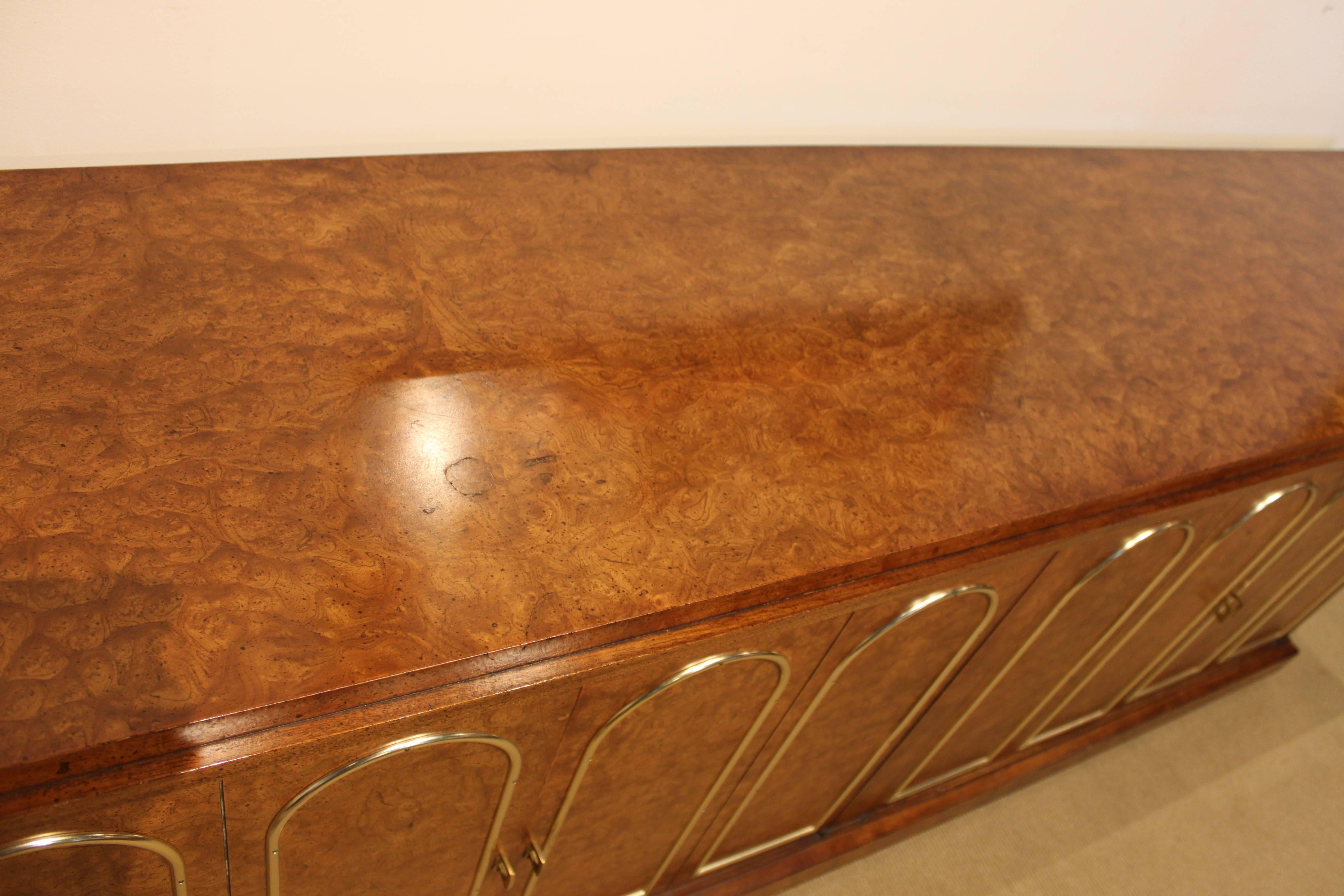 Great burl wood sideboard with brass accent.
