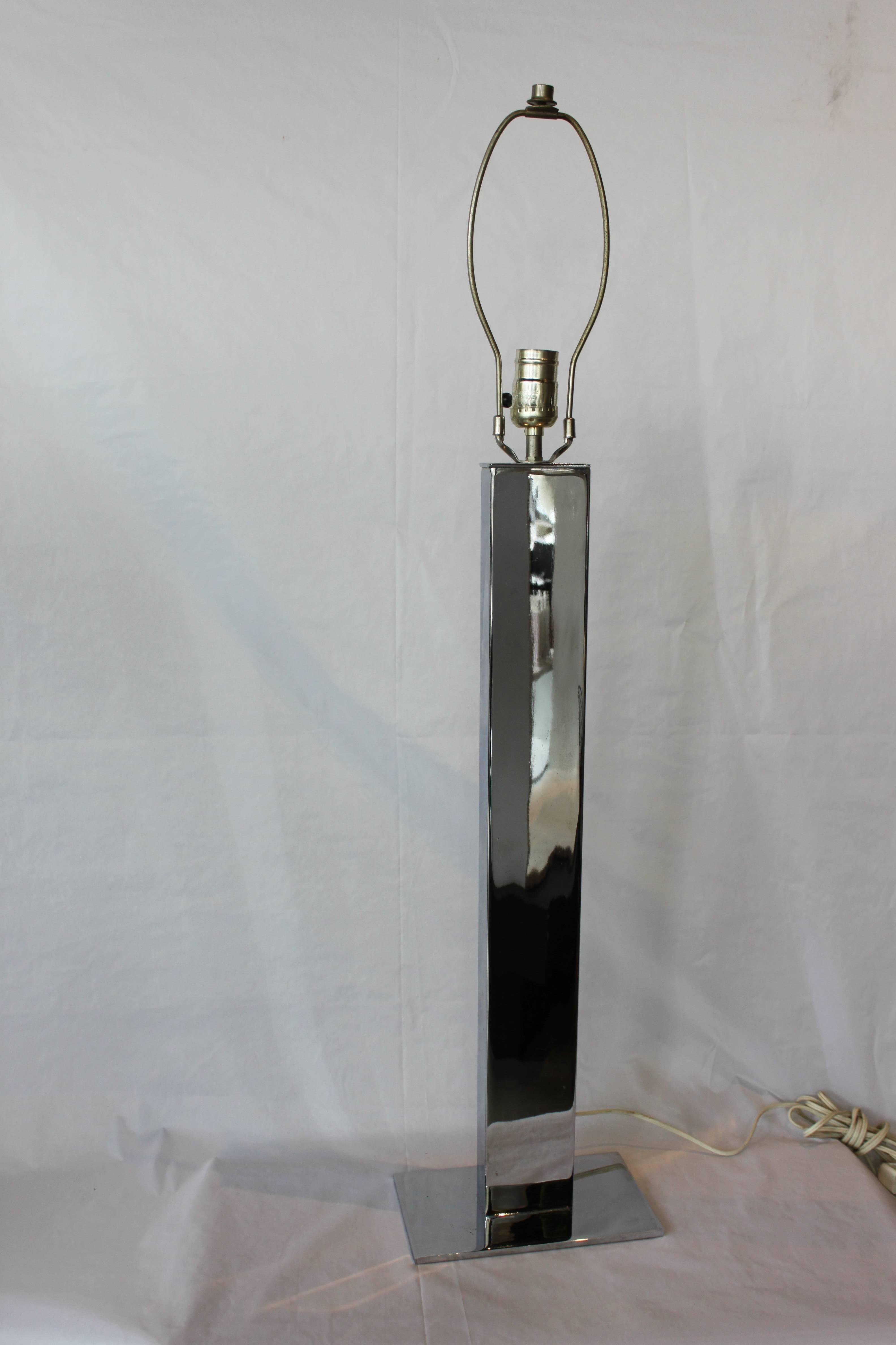 Vintage lamp in chrome finish. Minimalist modern design. Height is measured to top of the finial.