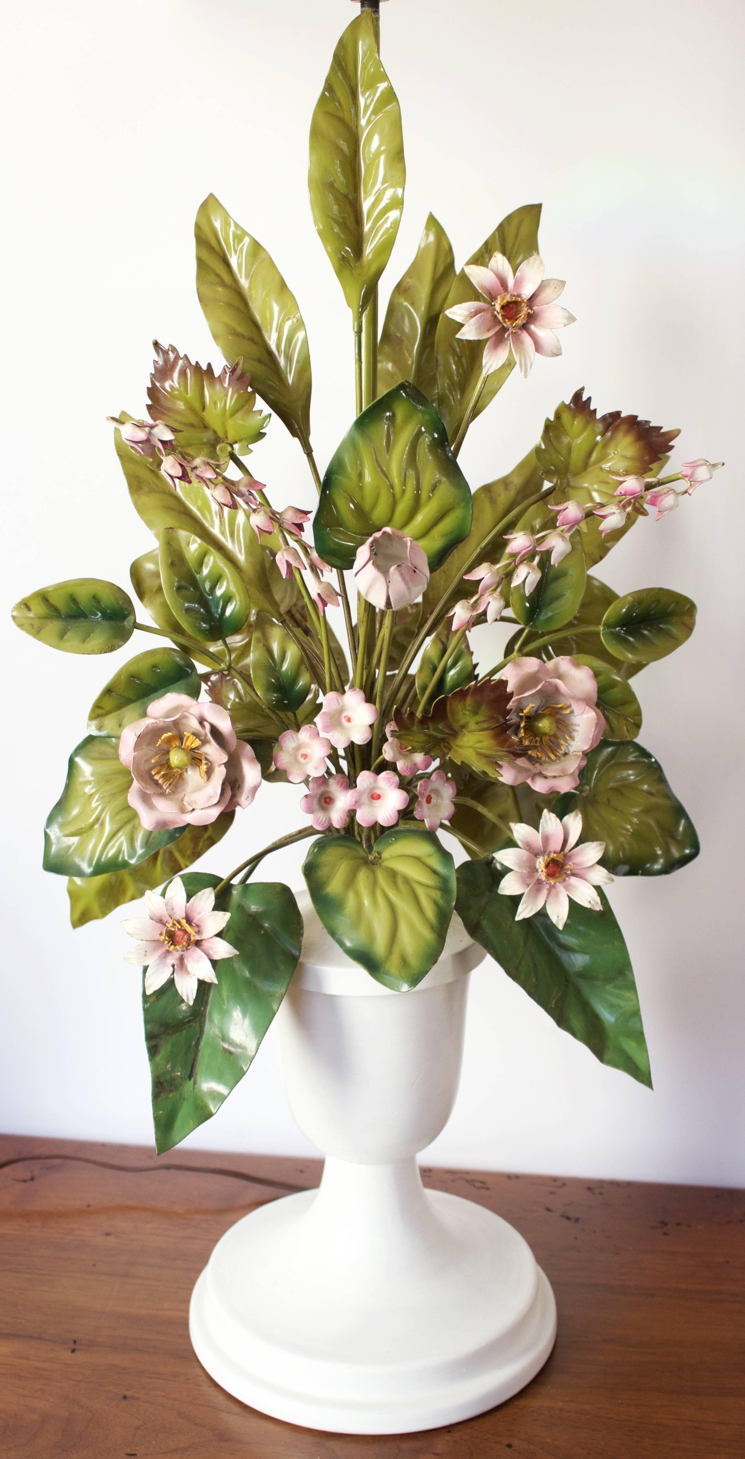 Very tall vintage Italian tole lamp of flowers and leaves arranged as a bouquet and can be viewed from all sides. Tole flora rest in a 