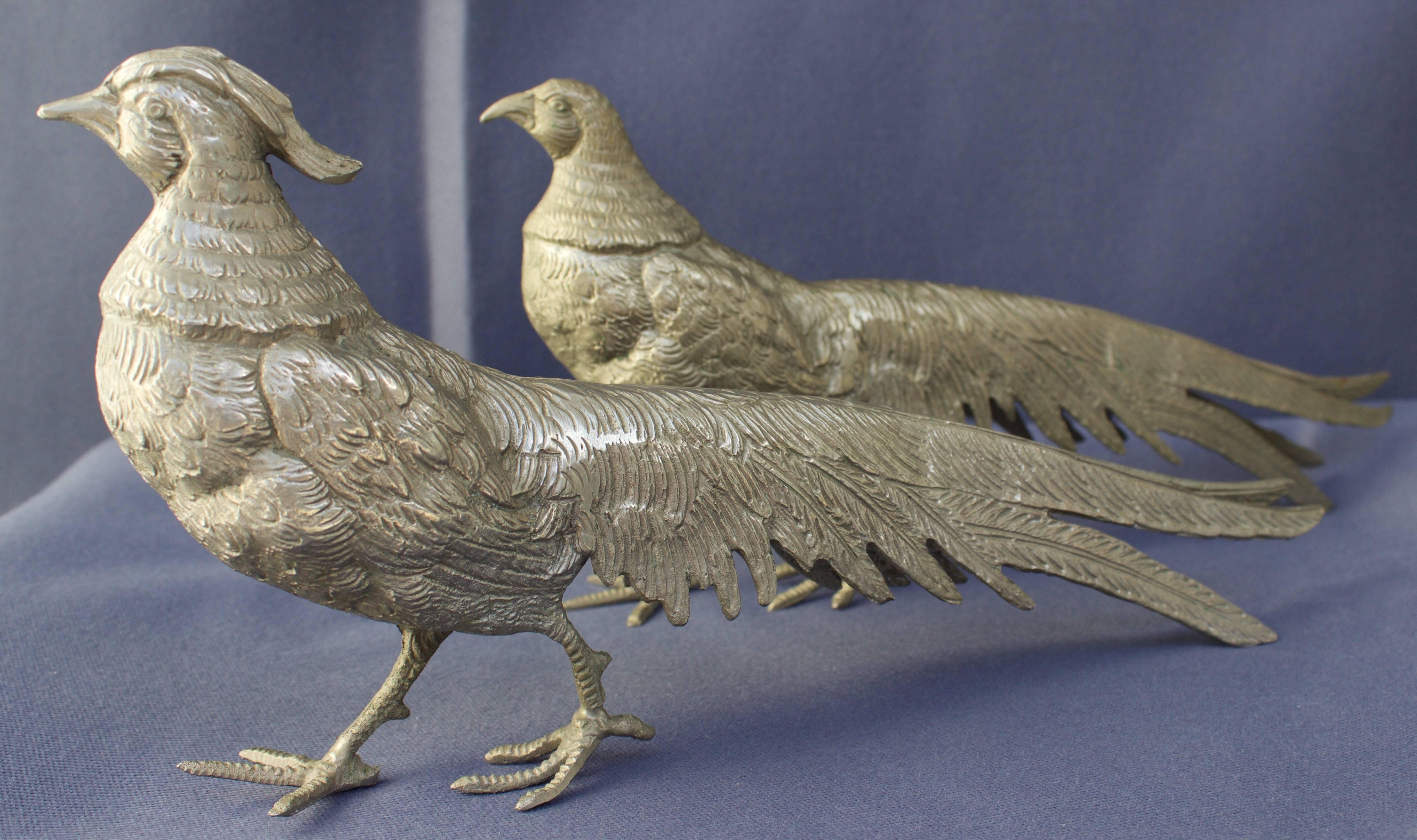 Male and female while metal pheasants for table decoration.
  