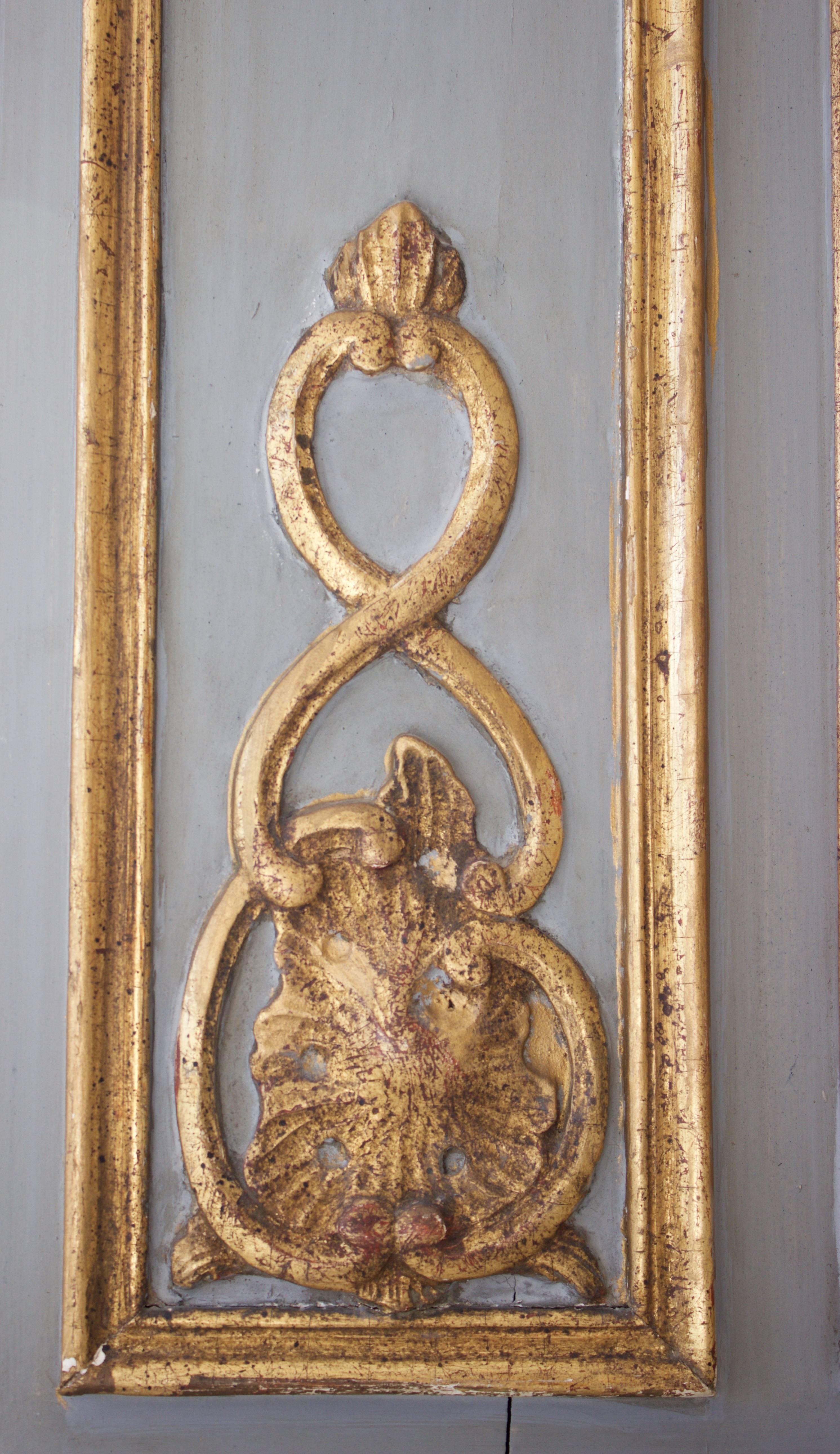 Antique mirror trumeau in a grey lacquered ground having fine carving and its original gilt gold on both frames. Typical of the Decorative French 