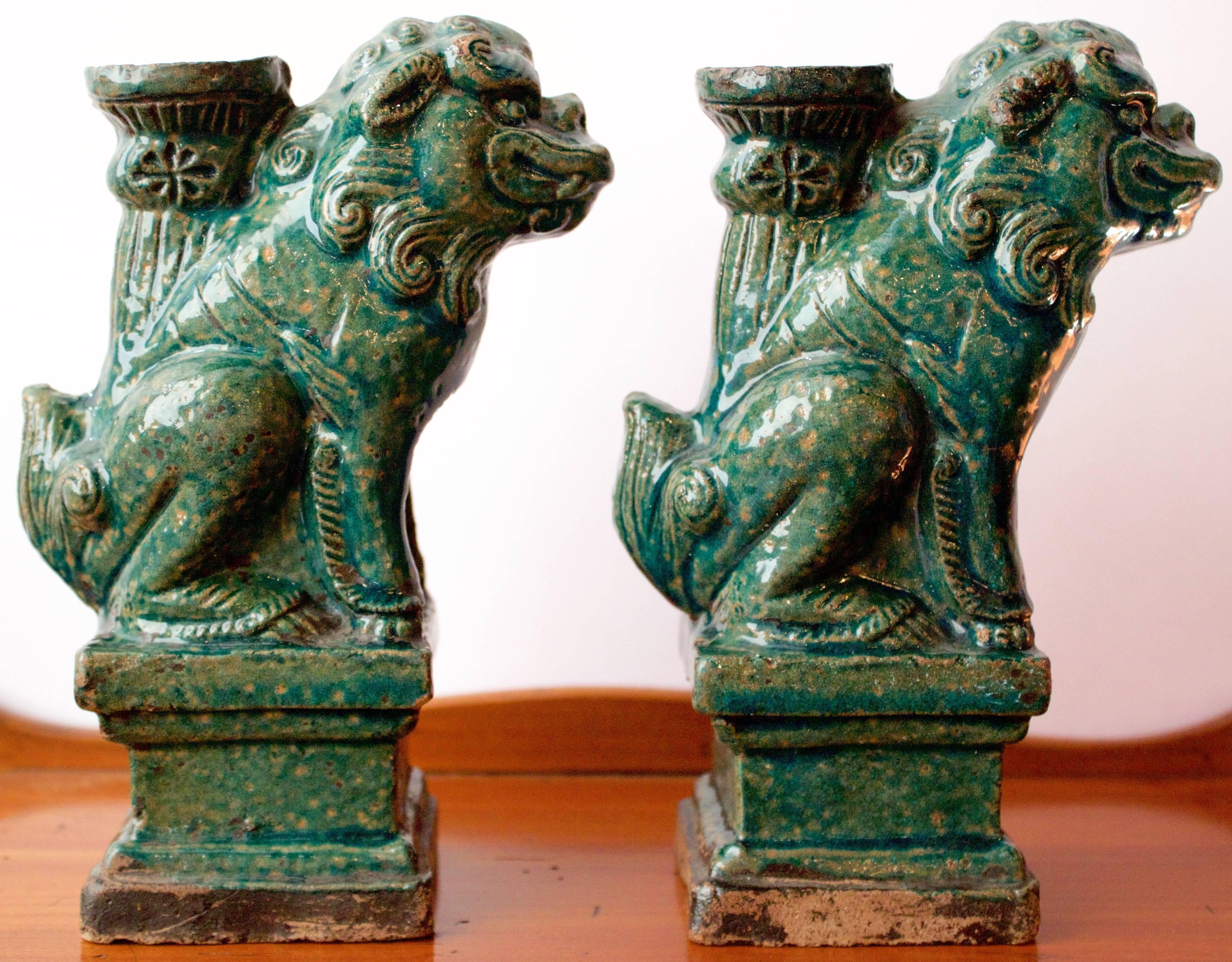 Pair of antique Chinese Joss Sticks made of stoneware and celadon glaze. Each figure represents a foo lion or guardian.