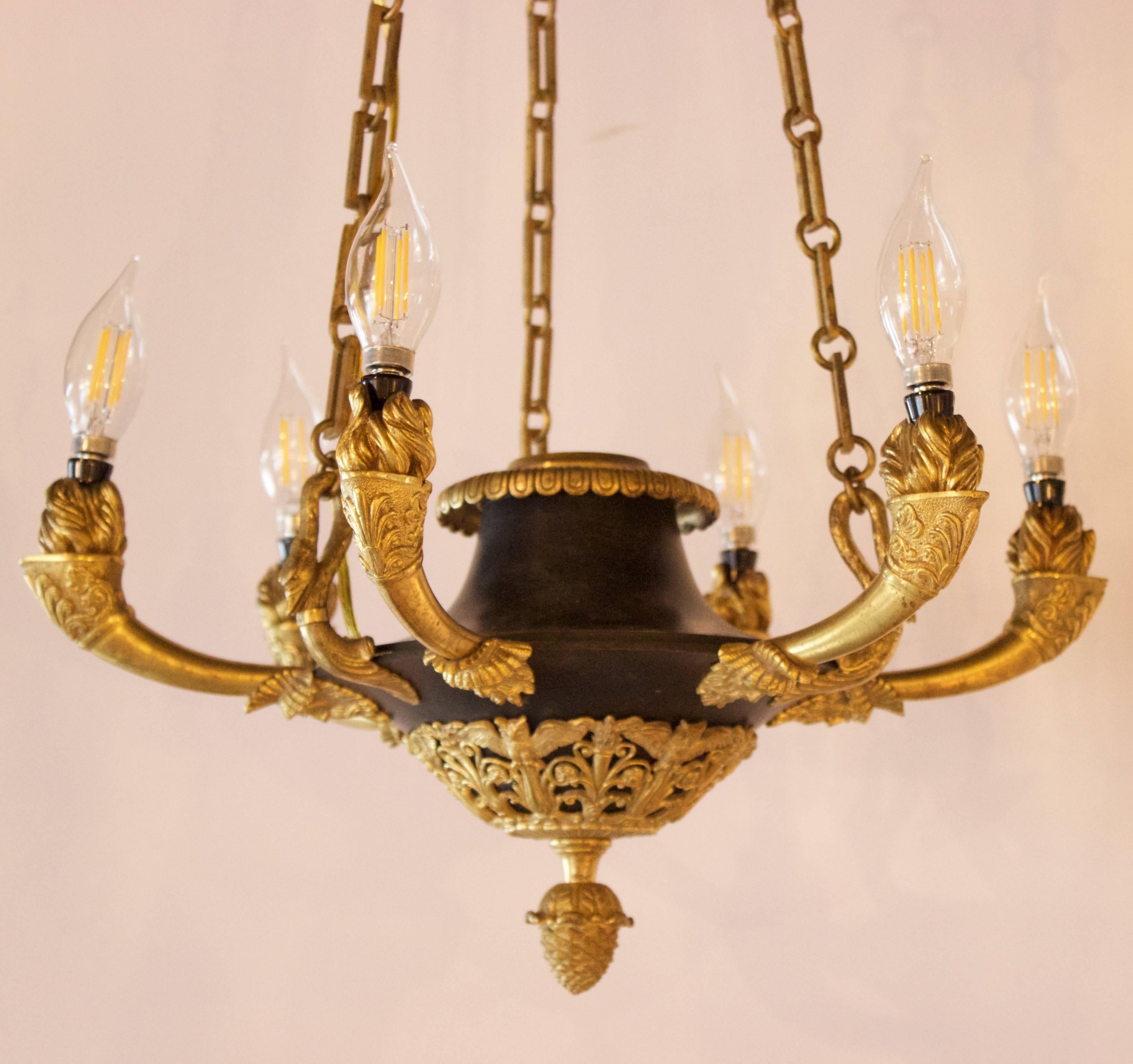 French 1st Empire Pd Chandelier with six lights,  
France, circa 1810.
Elegant and original in its design to fit the shape of an antique lamp. Made of very finely chased and or moulu gilded bronzes and patinated dark lacquered zinc based