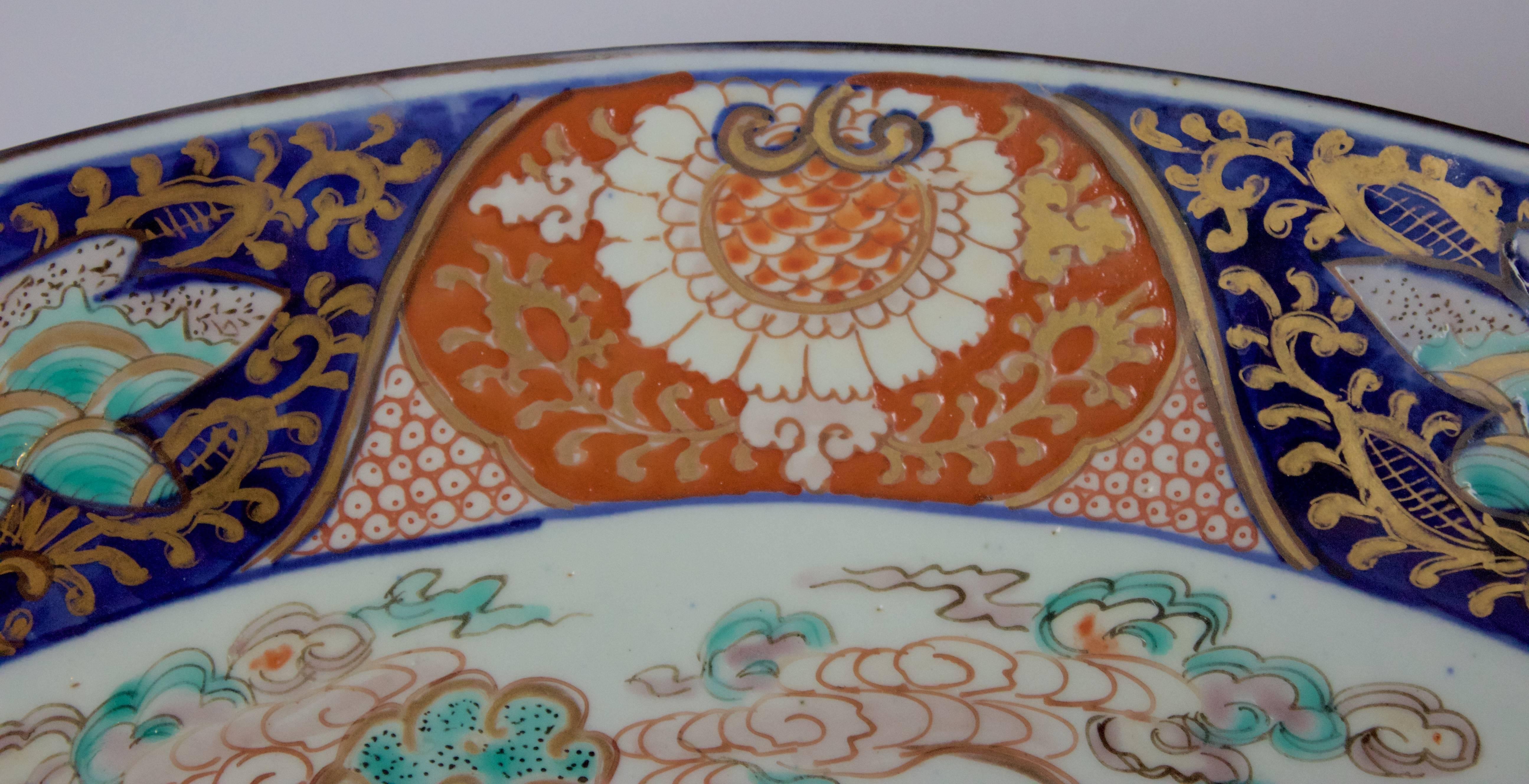 Beautiful large size (18in.) late 19th century. Japanese Imari charger. It is hand-painted on both sides.
Brilliant dark blue, red, orange, turquoise and green with gorgeous gold accents.
Extremely decorative piece.
Excellent condition (no chip,